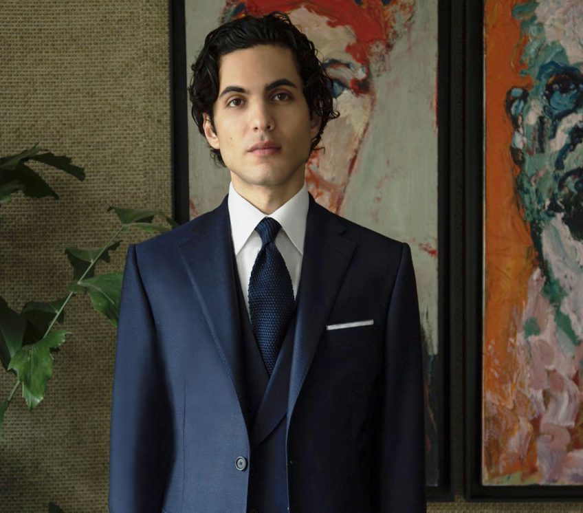 Model wears casely-hayford made to measure formal suit in navy.