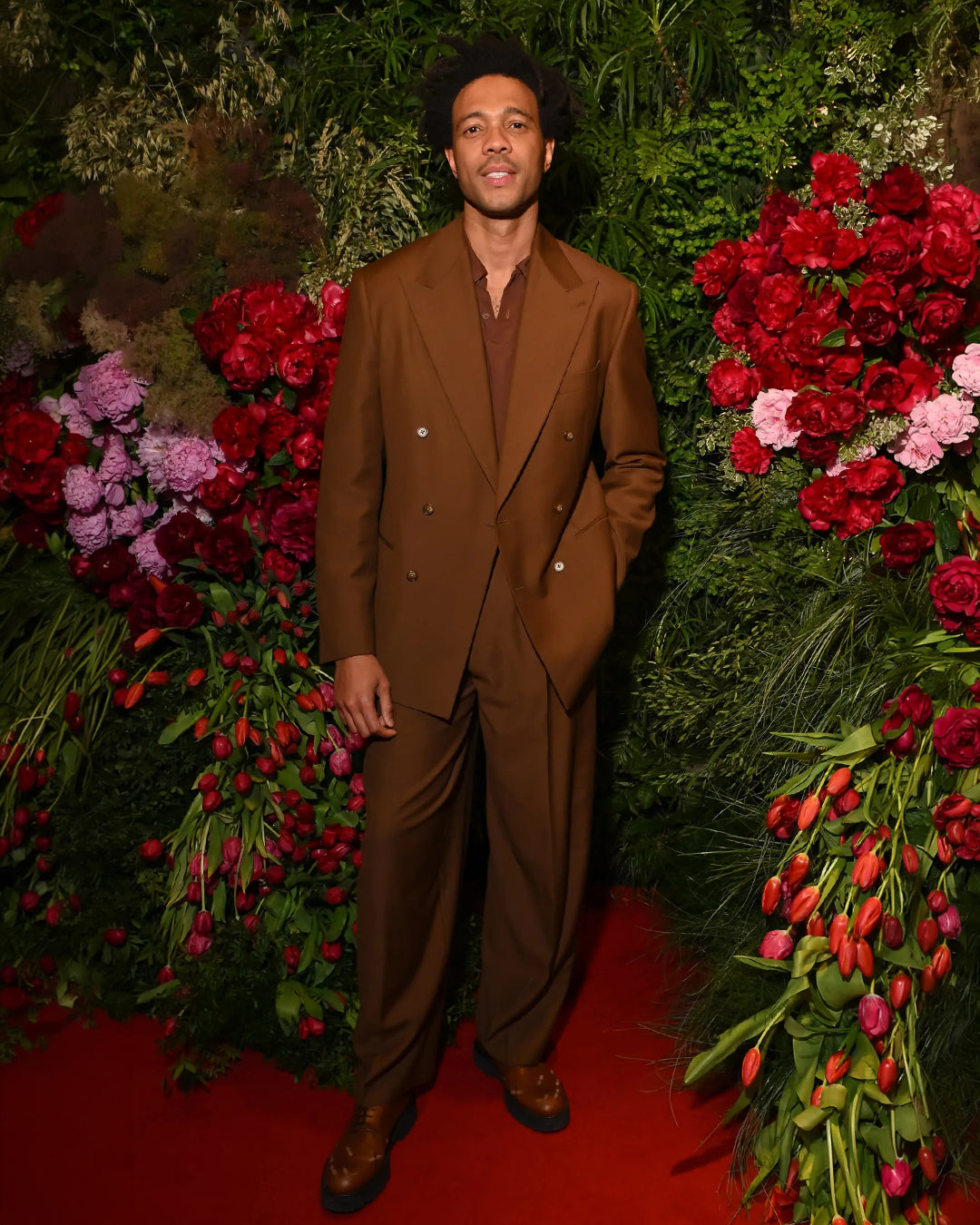 Charlie Casely-Hayford wears Arlo suit in brown paired with knit. 