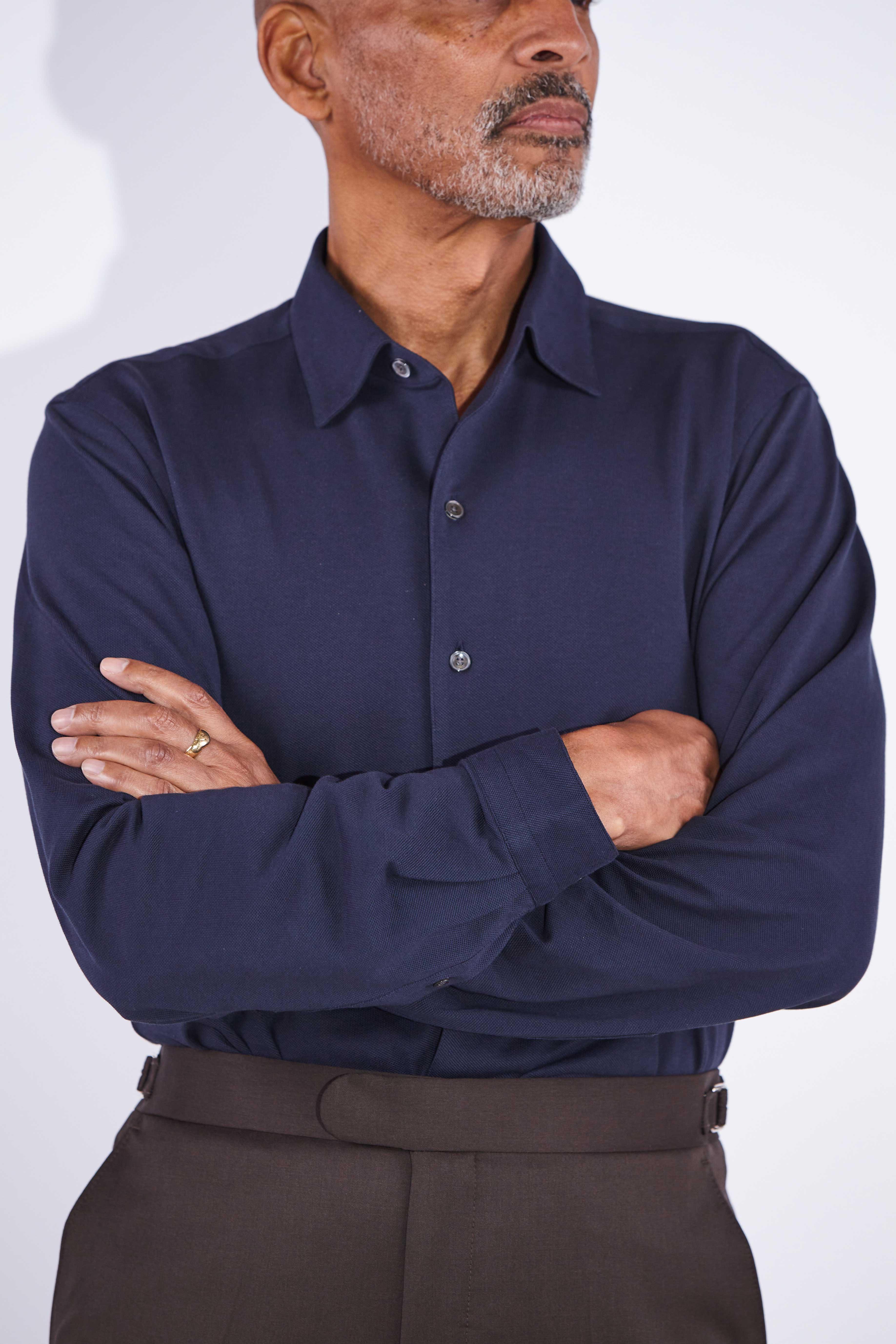 Model wears Casely-Hayford Jesper Navy One Piece Collar Pique Shirt. 