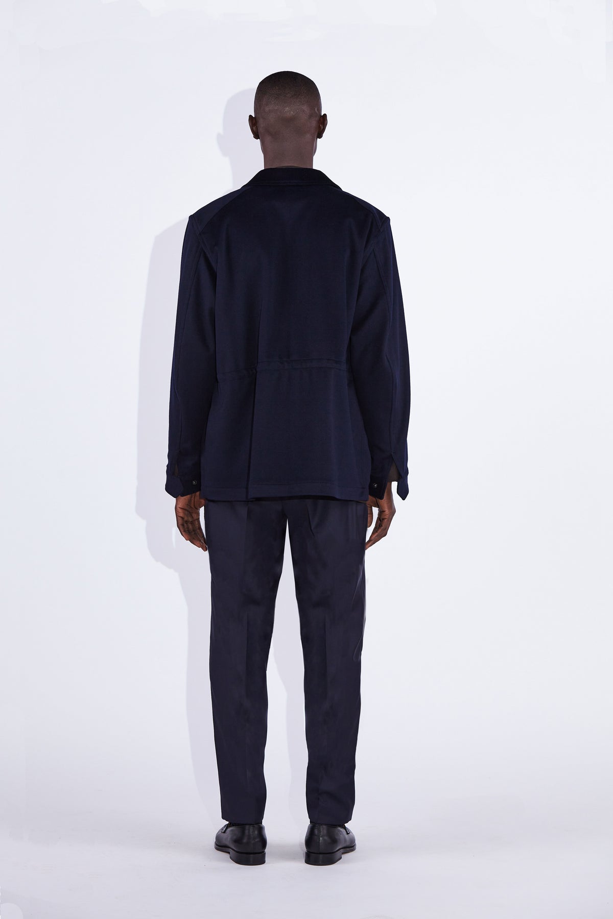 Model wear Casely-Hayford Fabian Navy Field Cotton Corduroy Jacket. 