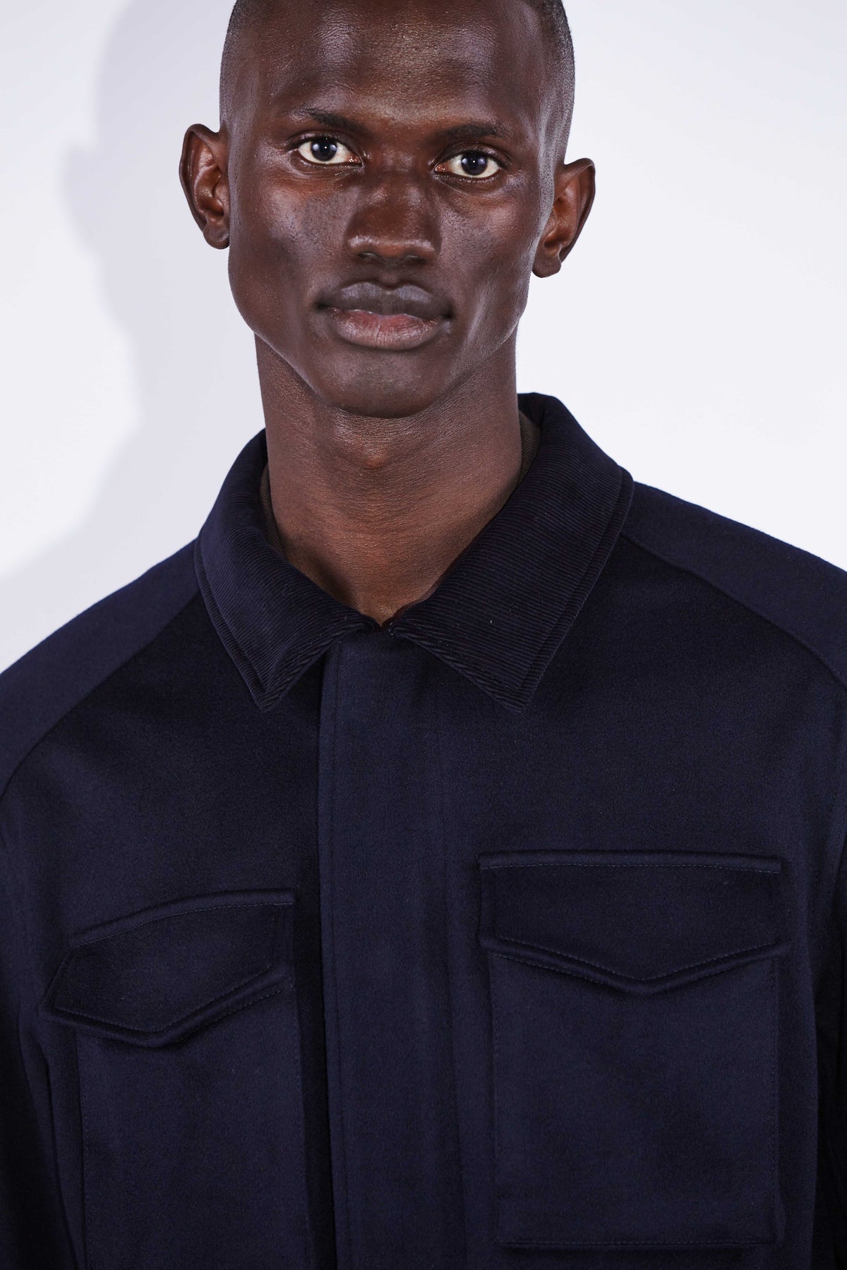 Model wear Casely-Hayford Fabian Navy Field Cotton Corduroy Jacket. 