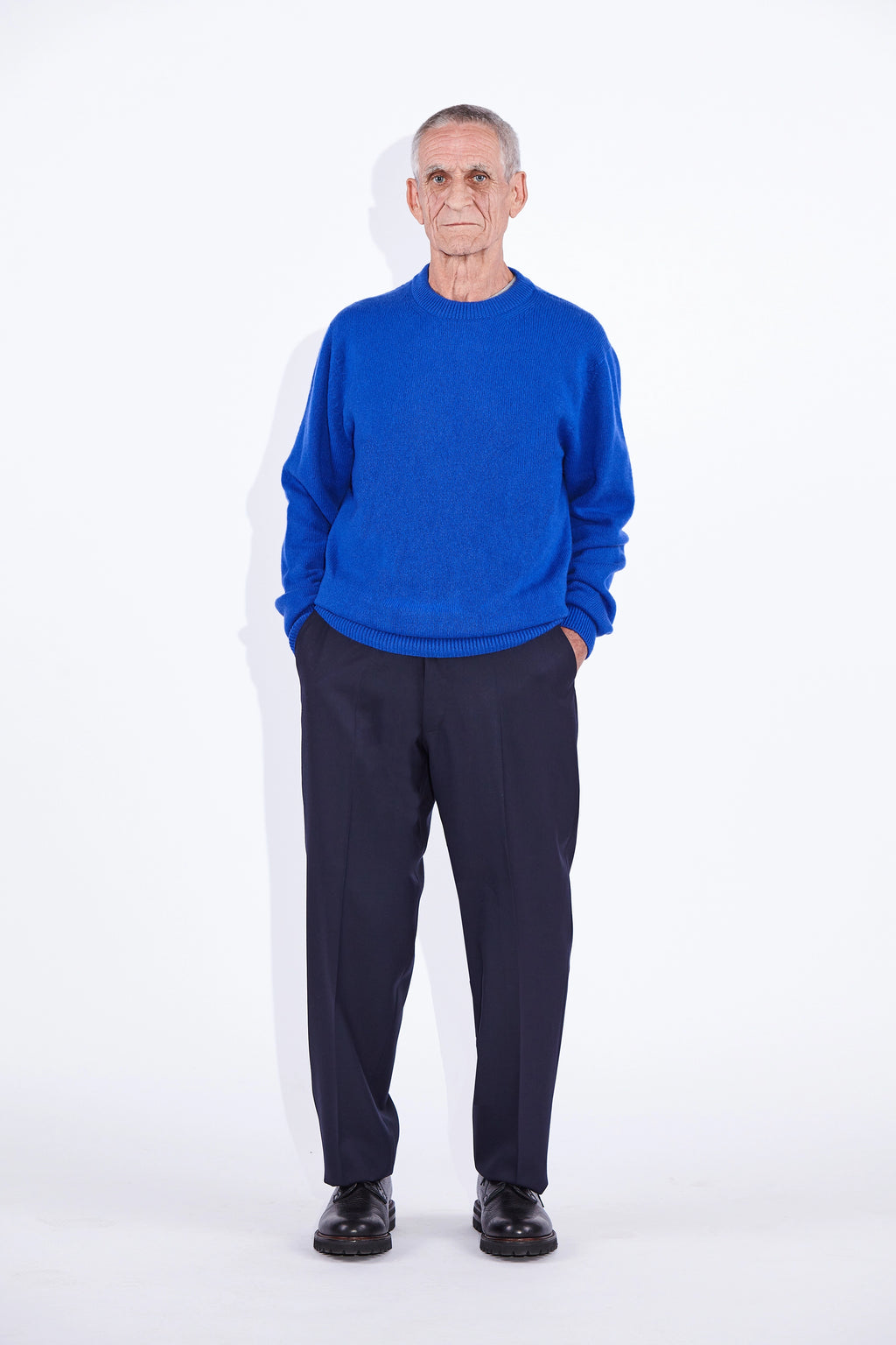 Model wears Casely-Hayford Rory Klein Cashmere Crew Neck Knit. 