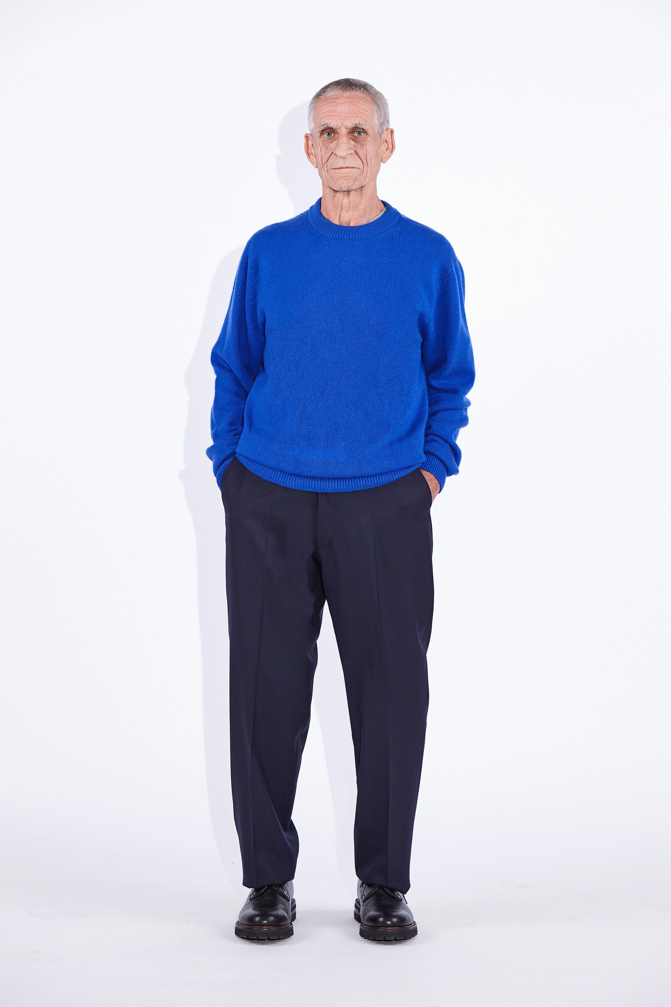 Model wears Casely-Hayford Rory Klein Cashmere Crew Neck Knit. 