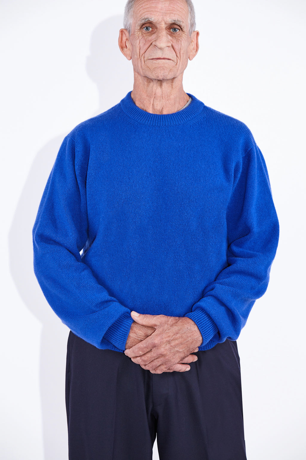 Model wears Casely-Hayford Rory Klein Cashmere Crew Neck Knit. 