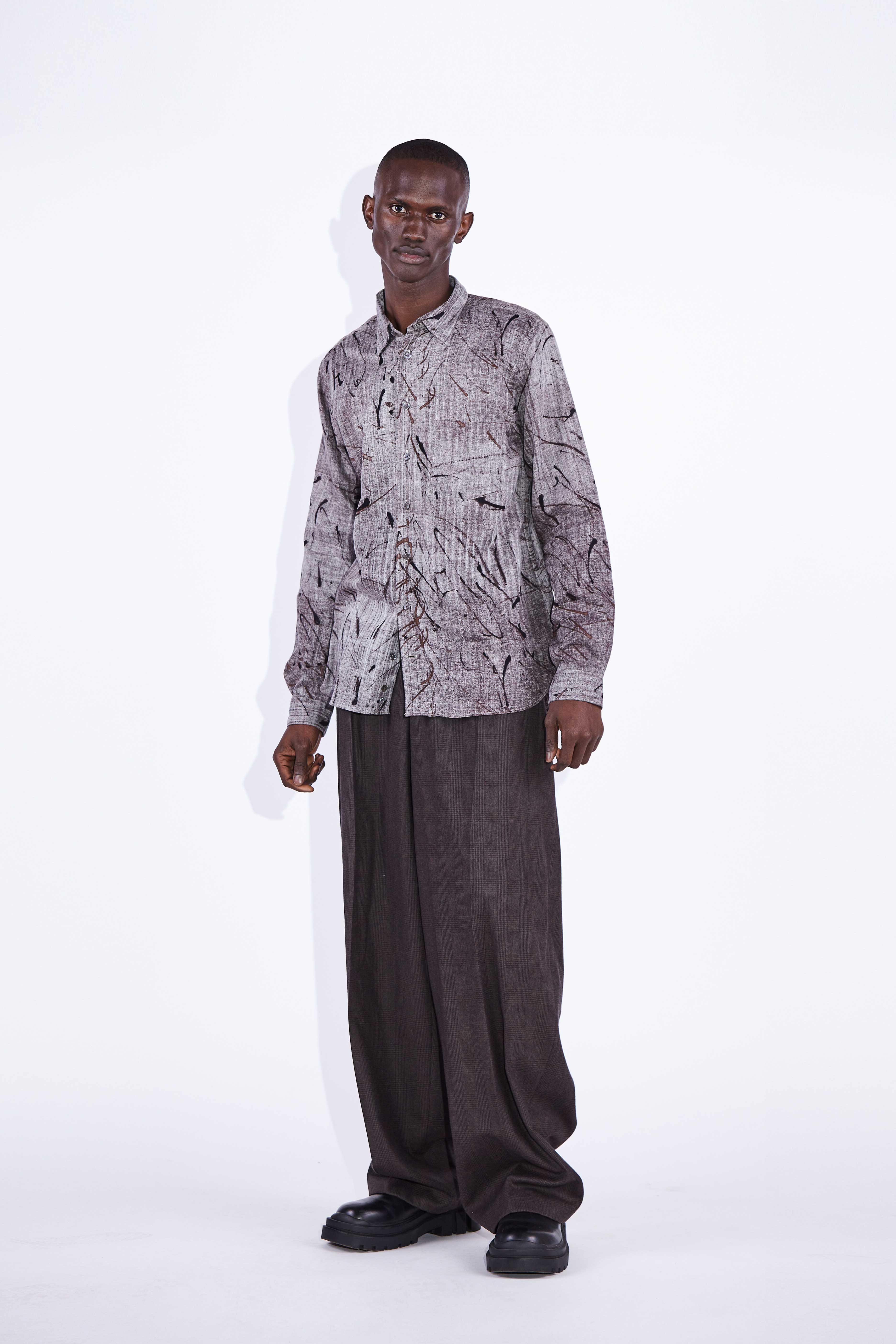 Model wears Stanway Brown Relaxed Cotton Shirt. 