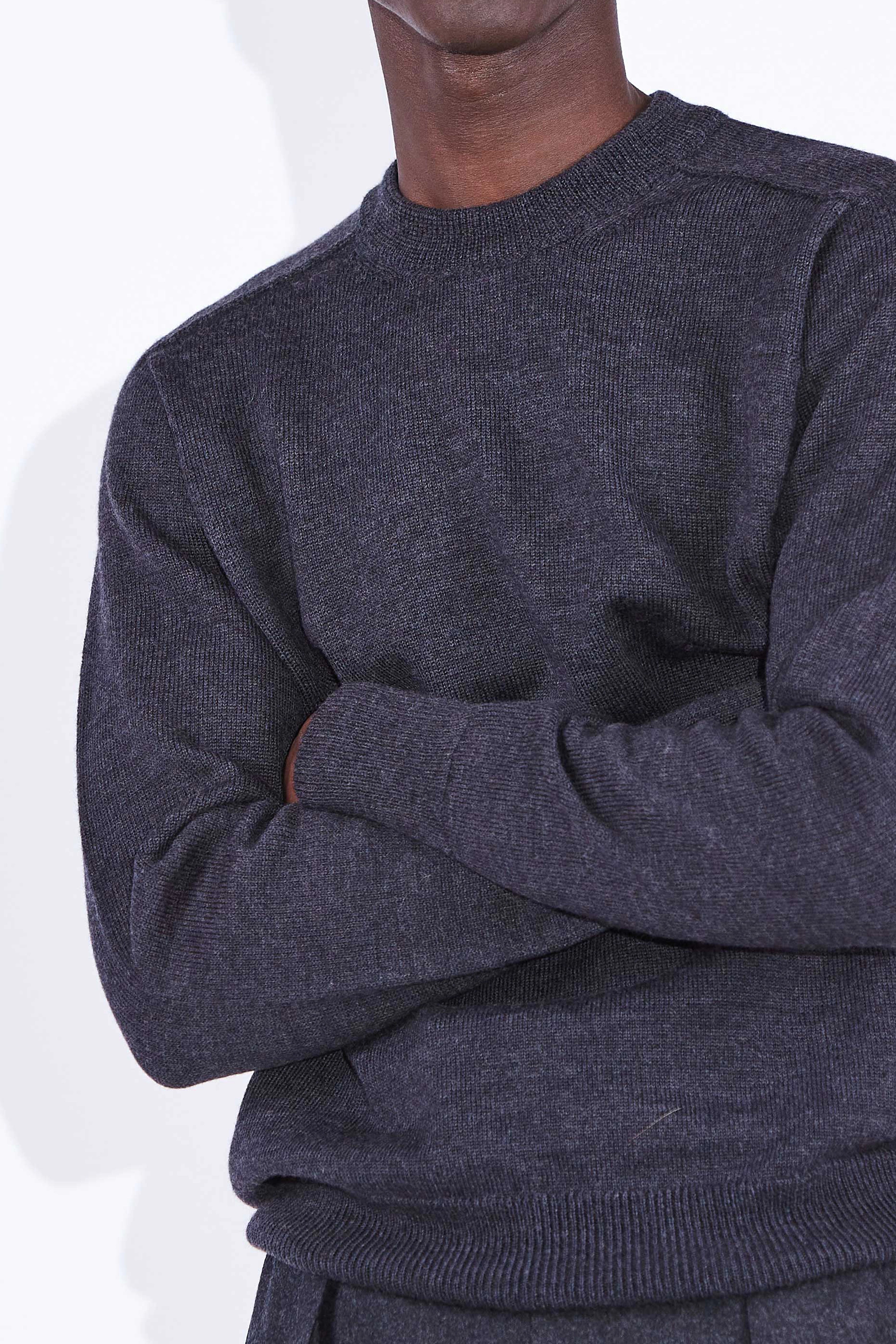 Model wears Casely-Hayford Nicolai Charcoal Merino Wool Knit. 