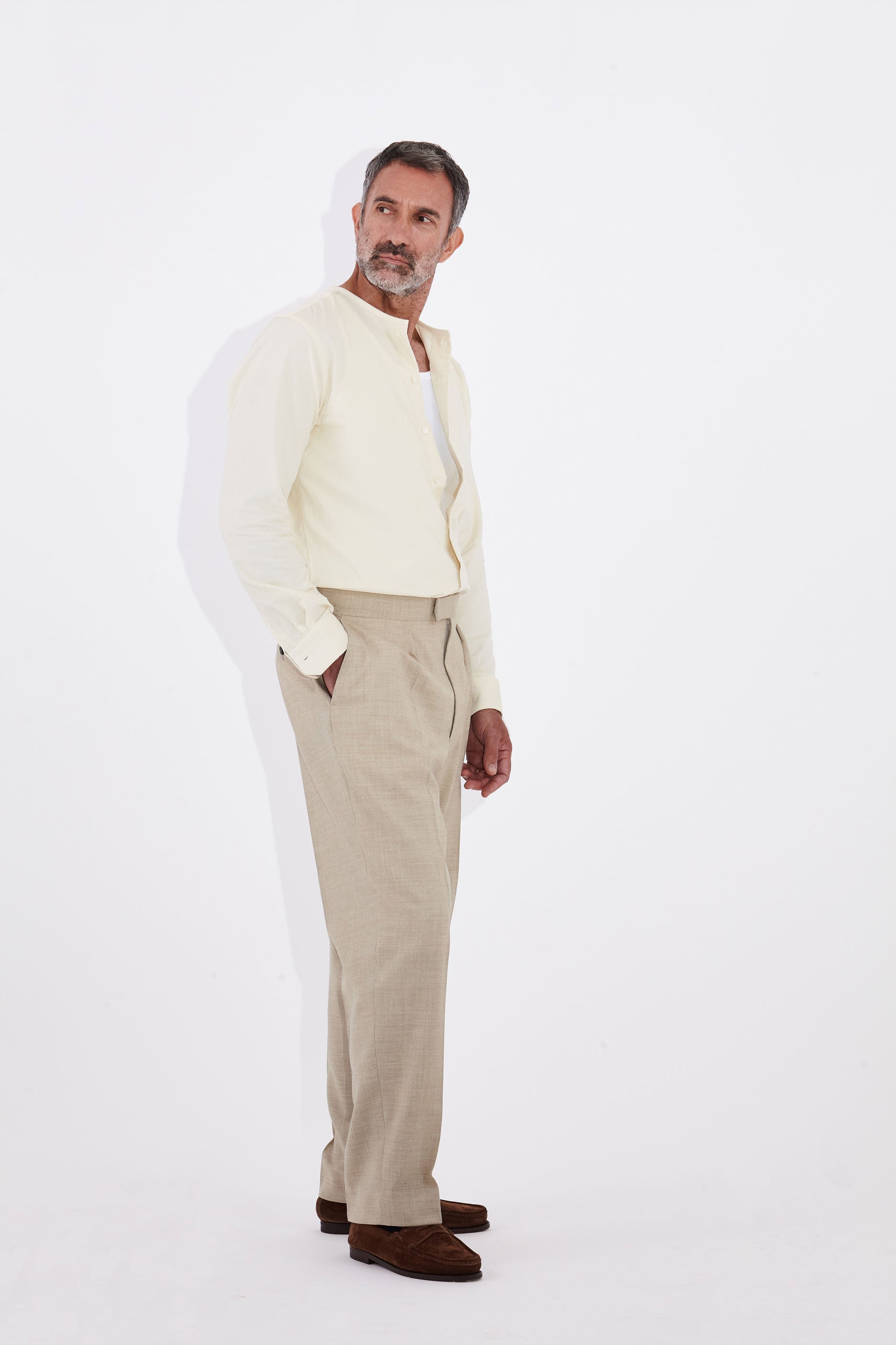 Model wears Casely-Hayford Pelle Collarless Shirt, Ivory Corduroy.