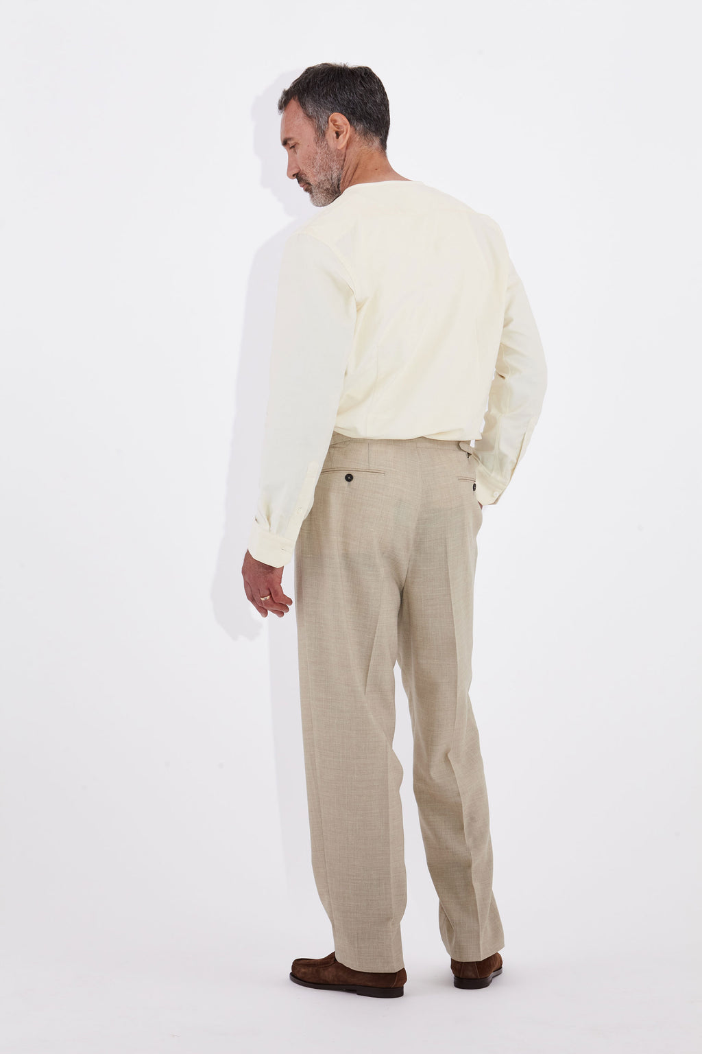 Model wears Casely-Hayford Pelle Collarless Shirt, Ivory Corduroy.