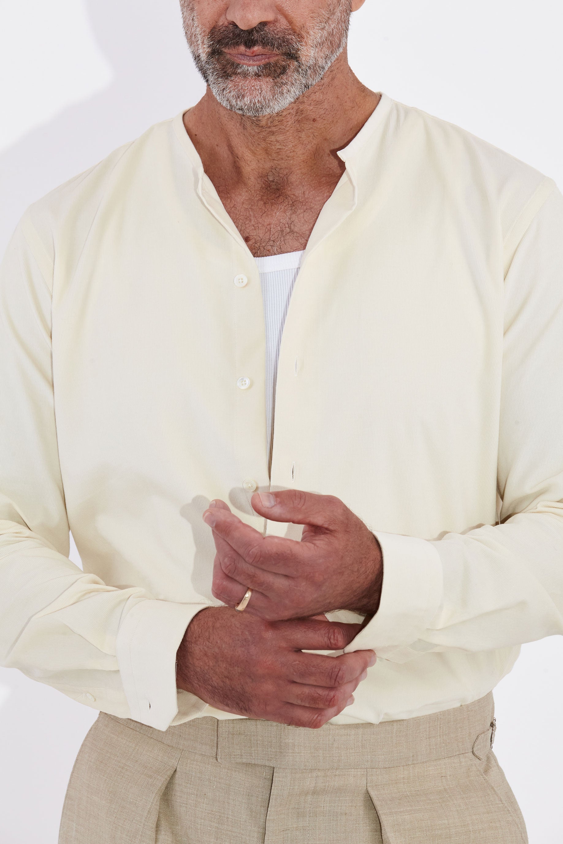 Model wears Casely-Hayford Pelle Collarless Shirt, Ivory Corduroy.