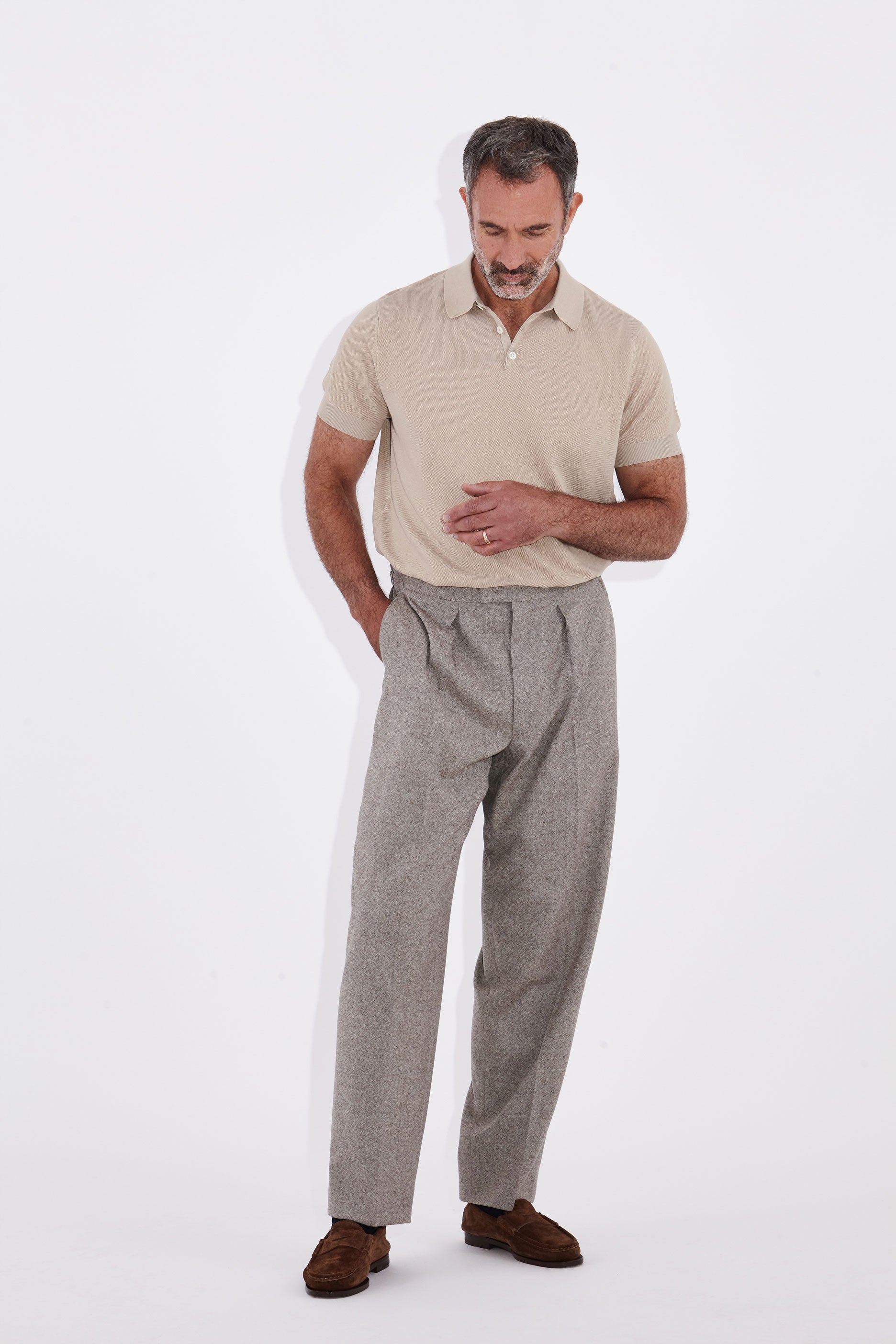 Model wears Casely-Hayford Kyle Sand Pique Polo Shirt.