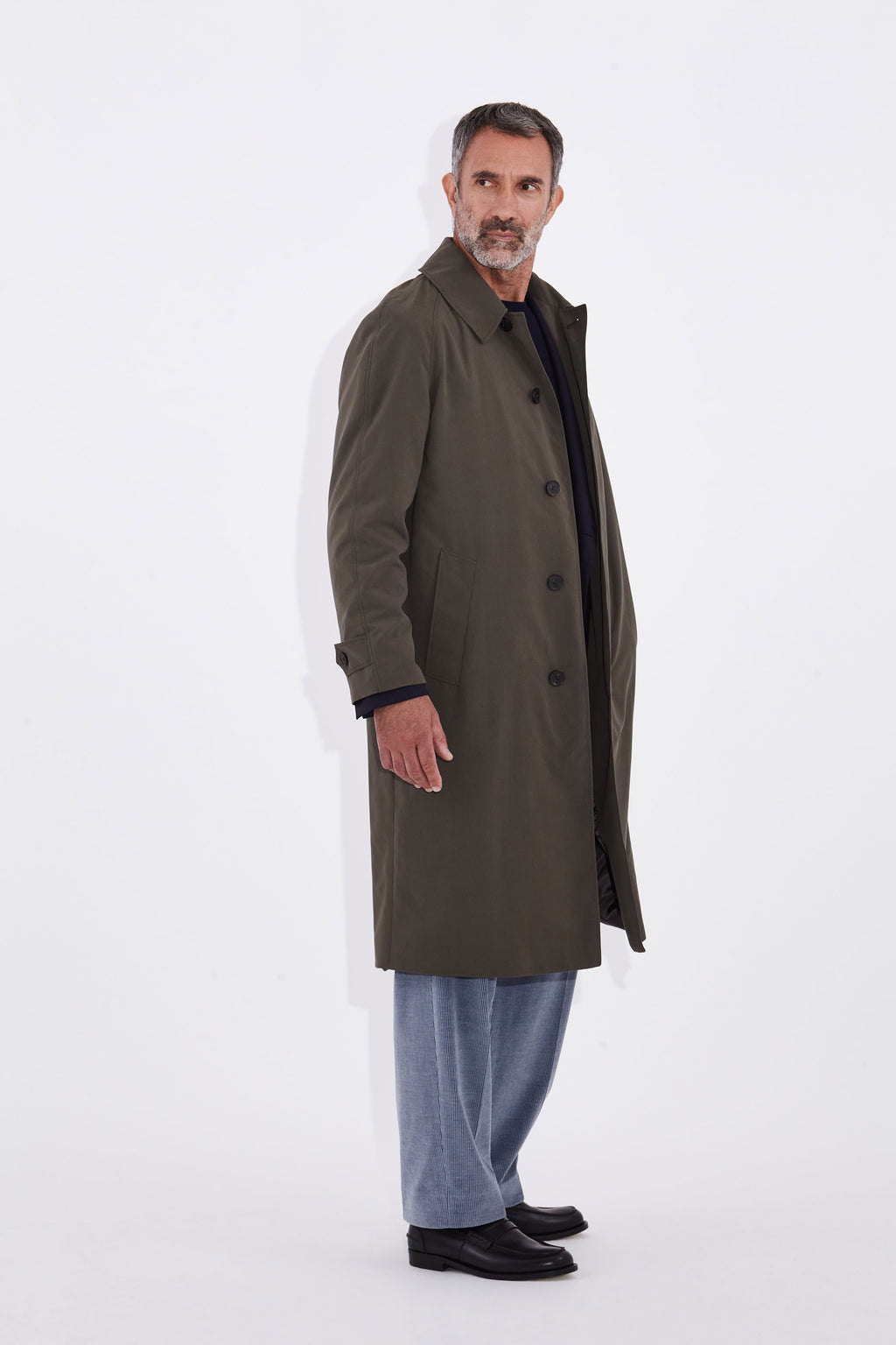 Model wears Casely Hayford Klee Lovat Raglan Overcoat.