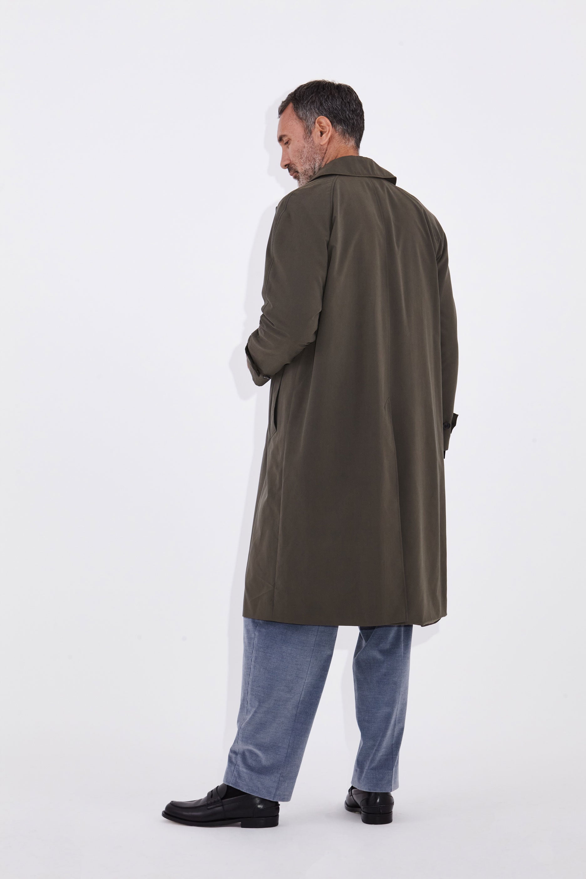 Model wears Casely-Hayford Klee Lovat Raglan Overcoat.