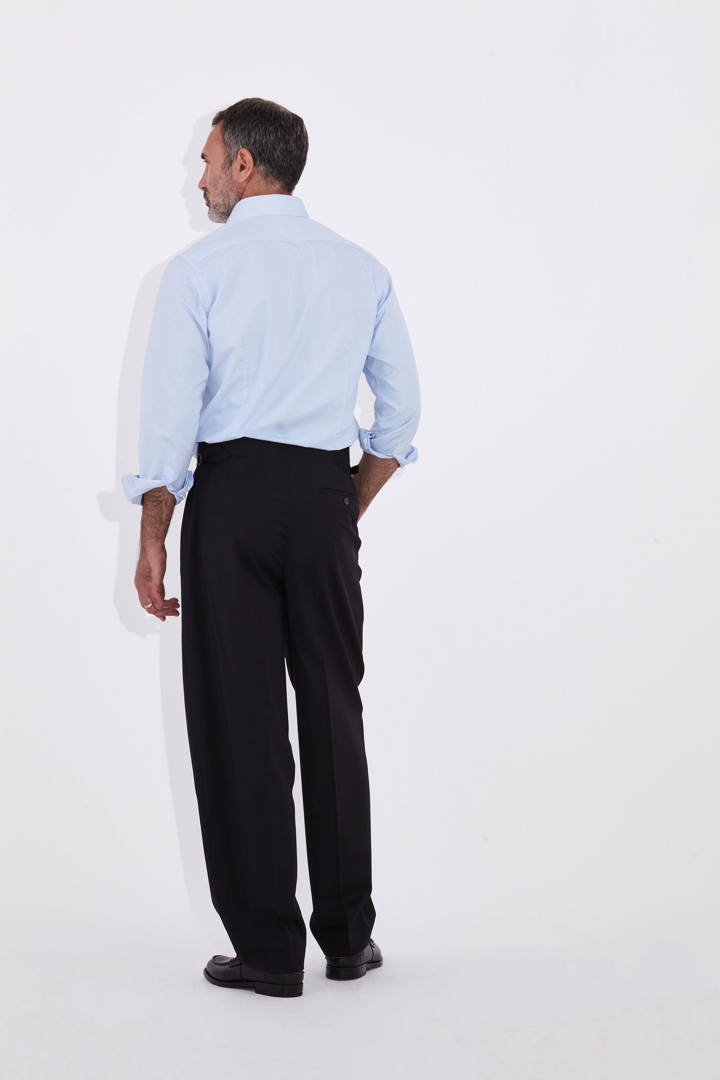 Model wears Casely Hayford Jackson Light Blue Oxford Classic London Collar Shirt. 