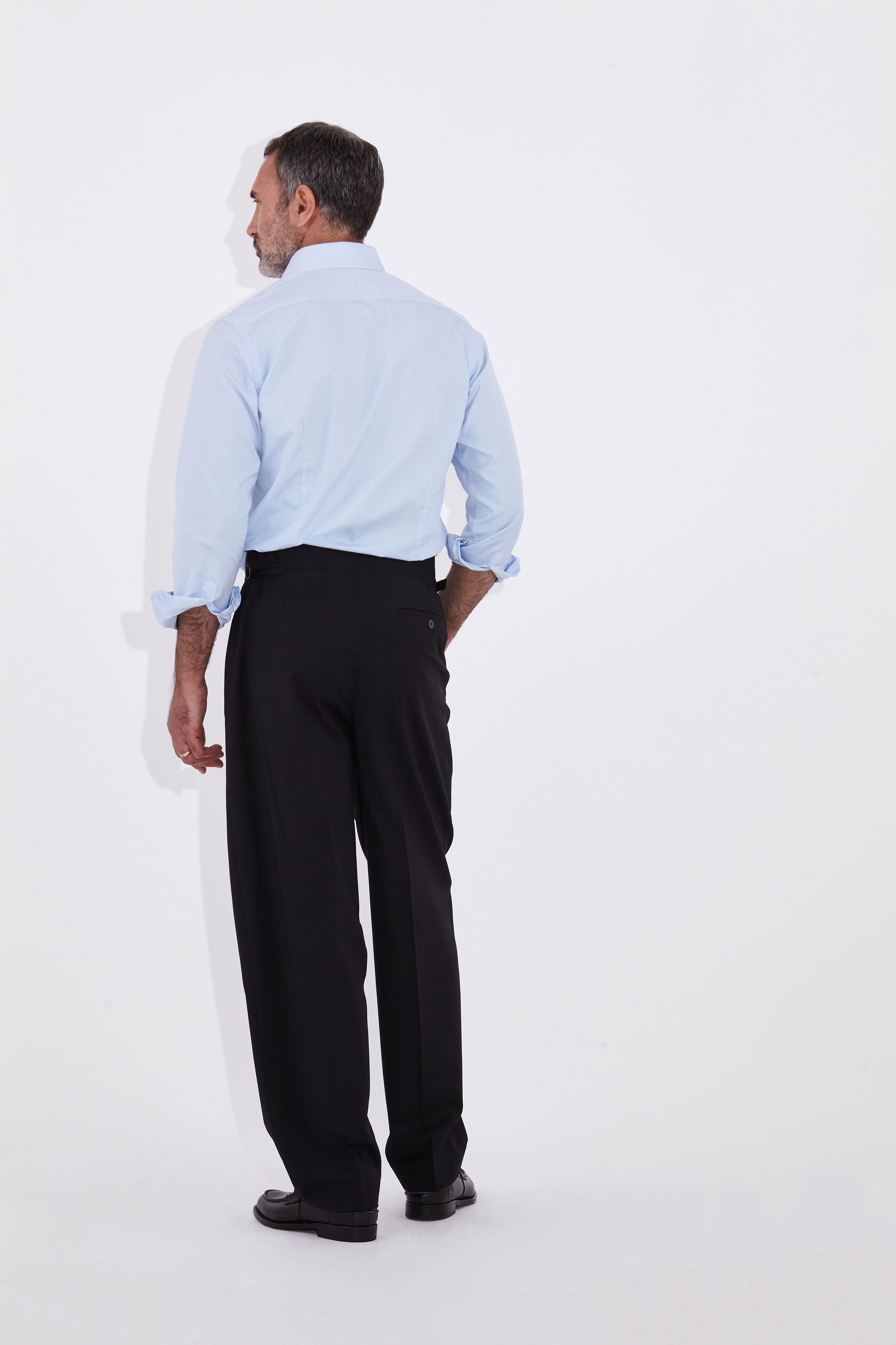 Model wears Casely Hayford Jackson Light Blue Oxford Classic London Collar Shirt. 