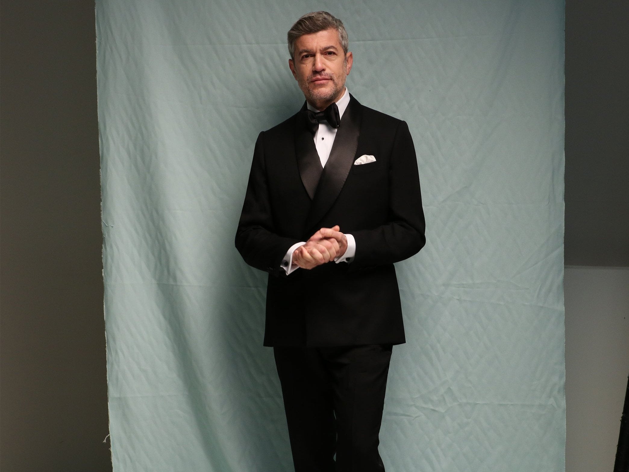 Model wears Casely-Hayford made-to-measure Tuxedo in black