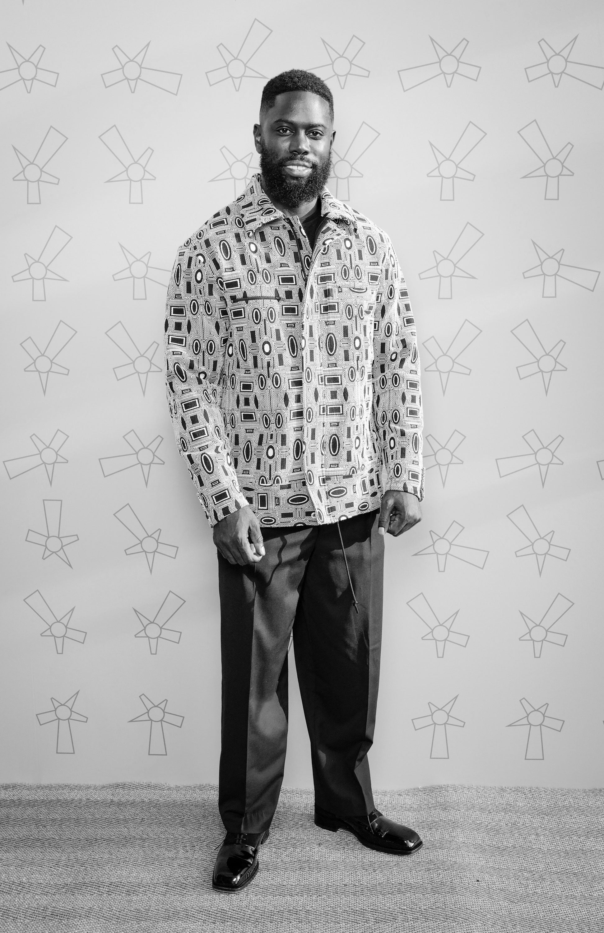 British rapper Ghetts wears Casely-Hayford Jacquard OSKAR Jacket. 