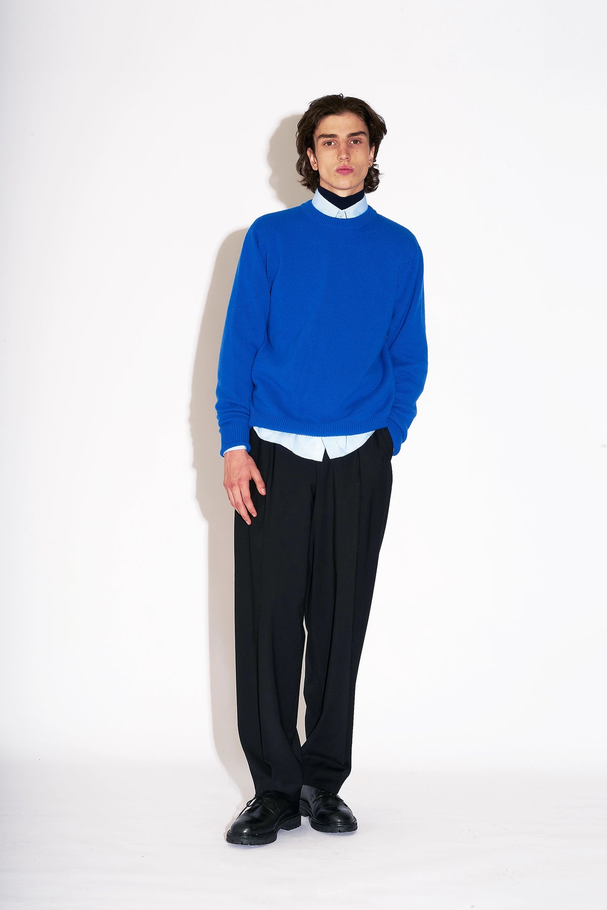 Model wears Casely-Hayford Hannes Black Wide Legged Wool Trousers.