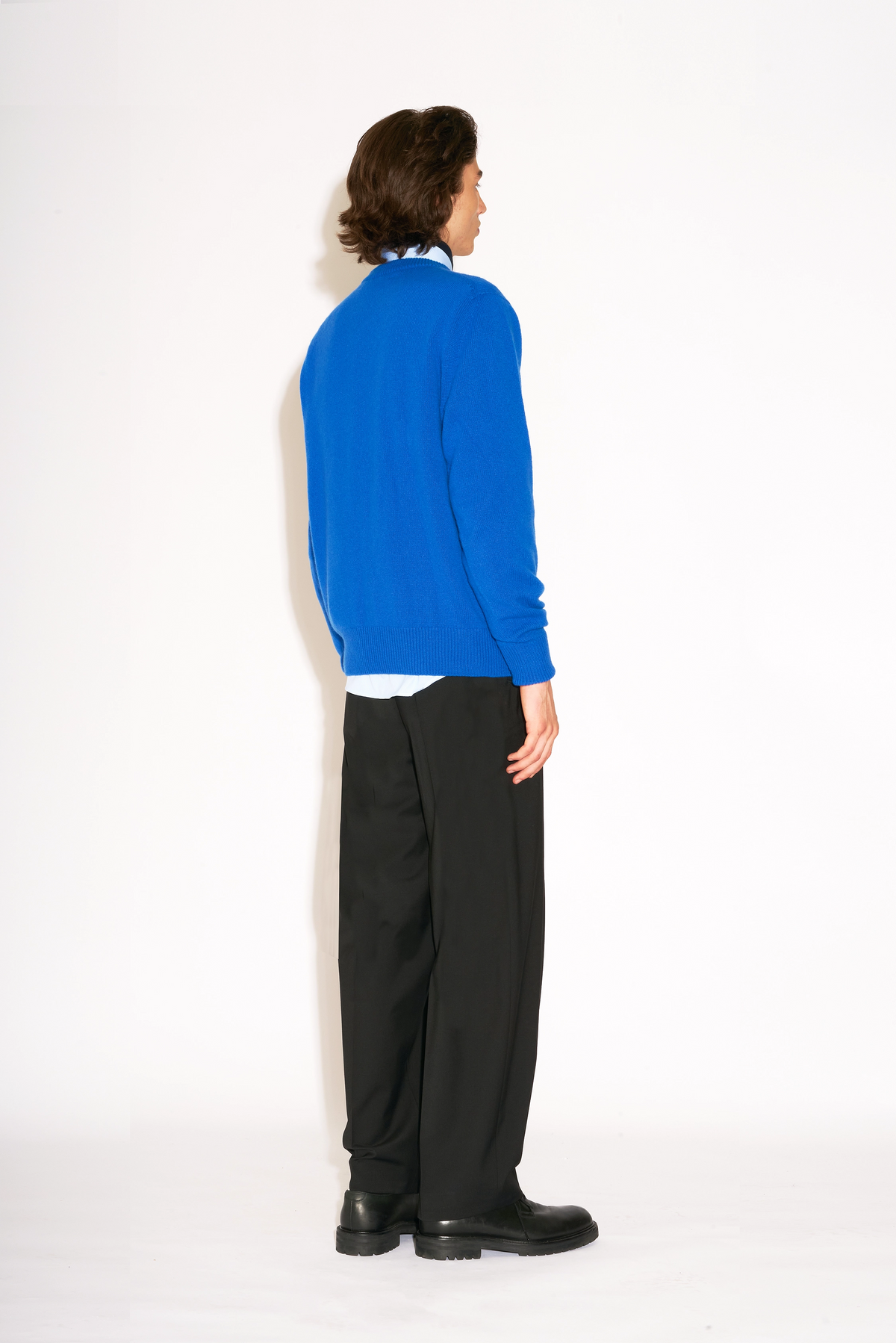 Model wears Casely-Hayford Hannes Black Wide Legged Wool Trousers.