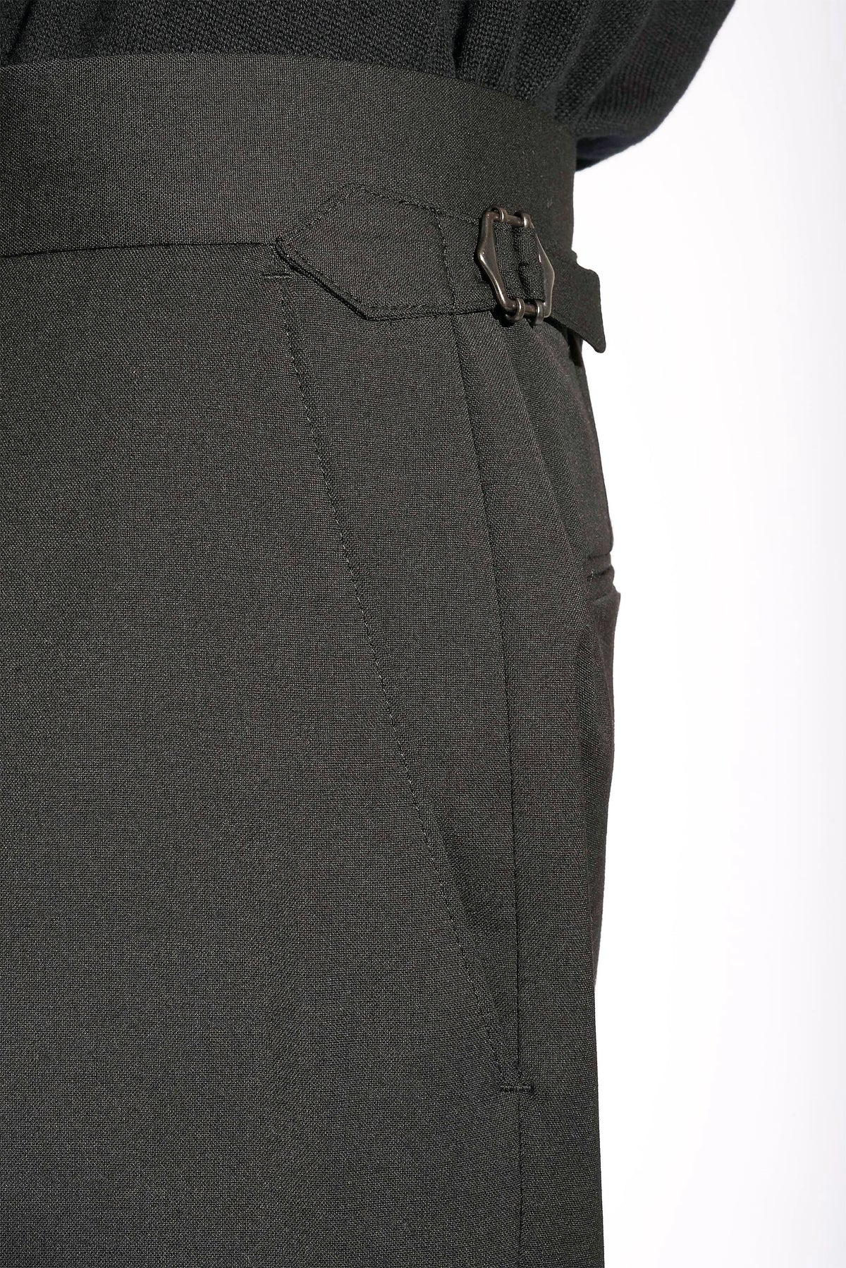 Model wears Casely-Hayford Hannes Black Wide Legged Wool Trousers.