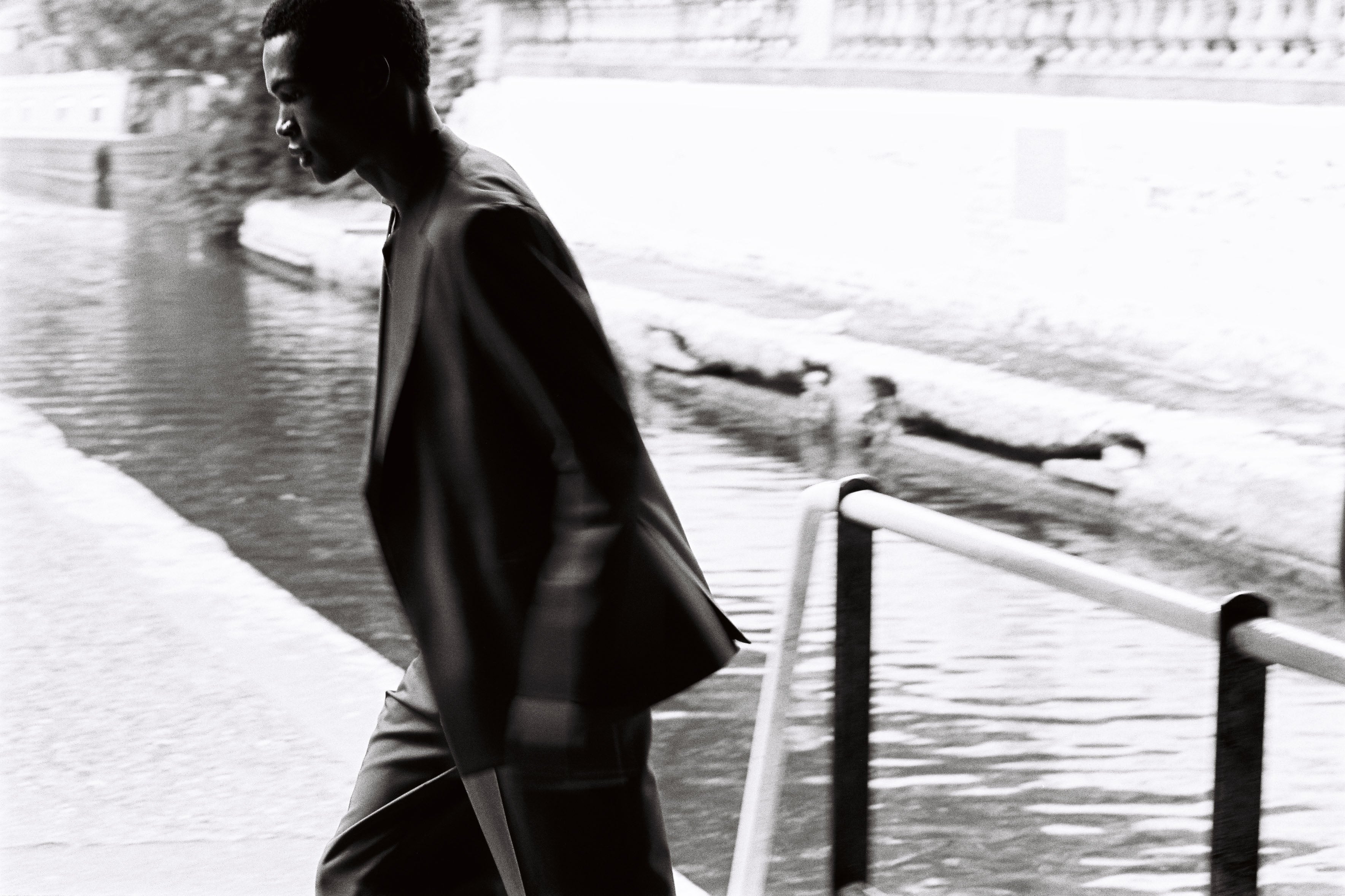 Model wears Casely-Hayford OFILI suit in brown. 