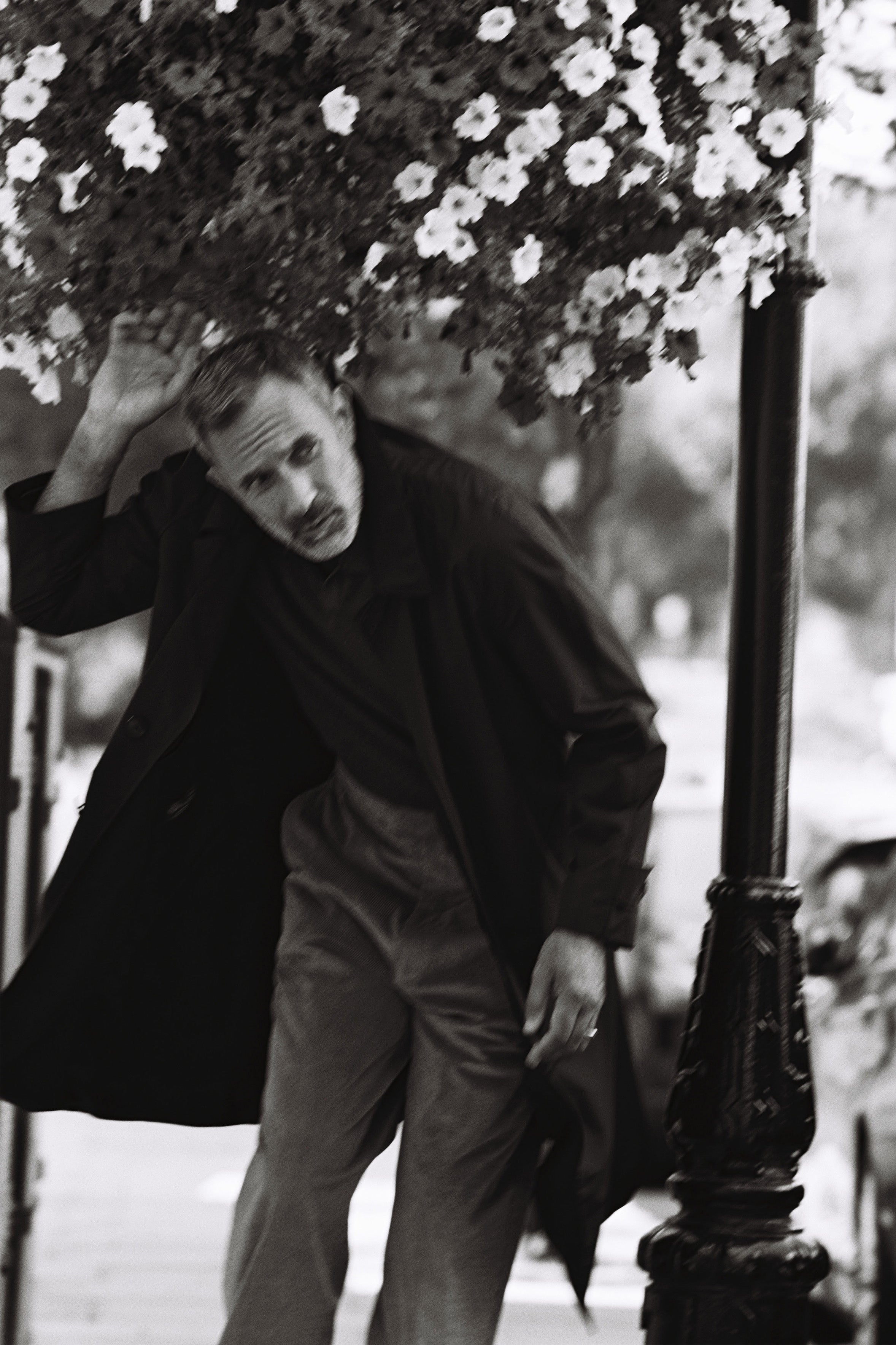 Model wears Casely-Hayford Klee coat and Fidel trousers. 