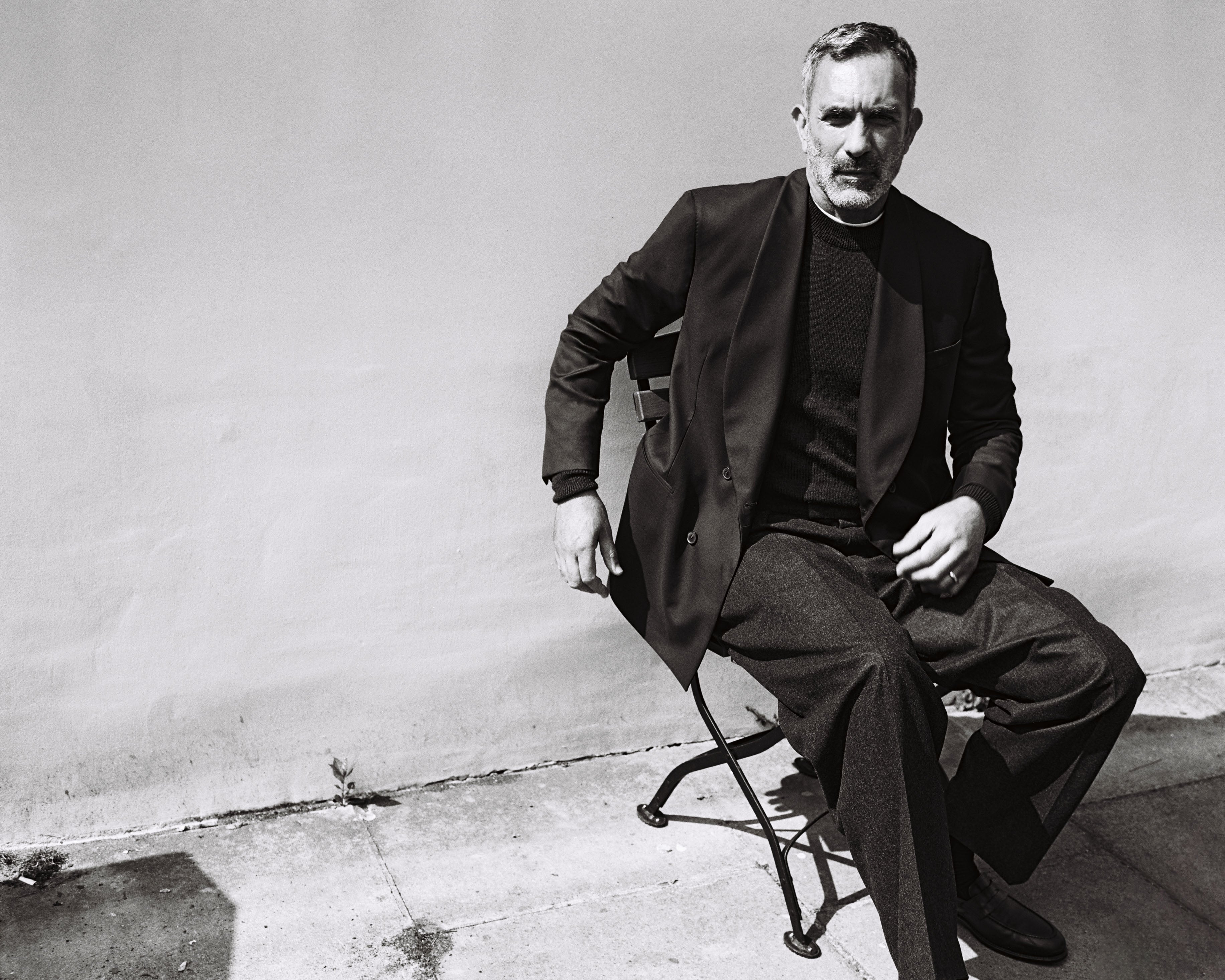 Model wears Casely-Hayford relaxed fit jacket and knitwear. 