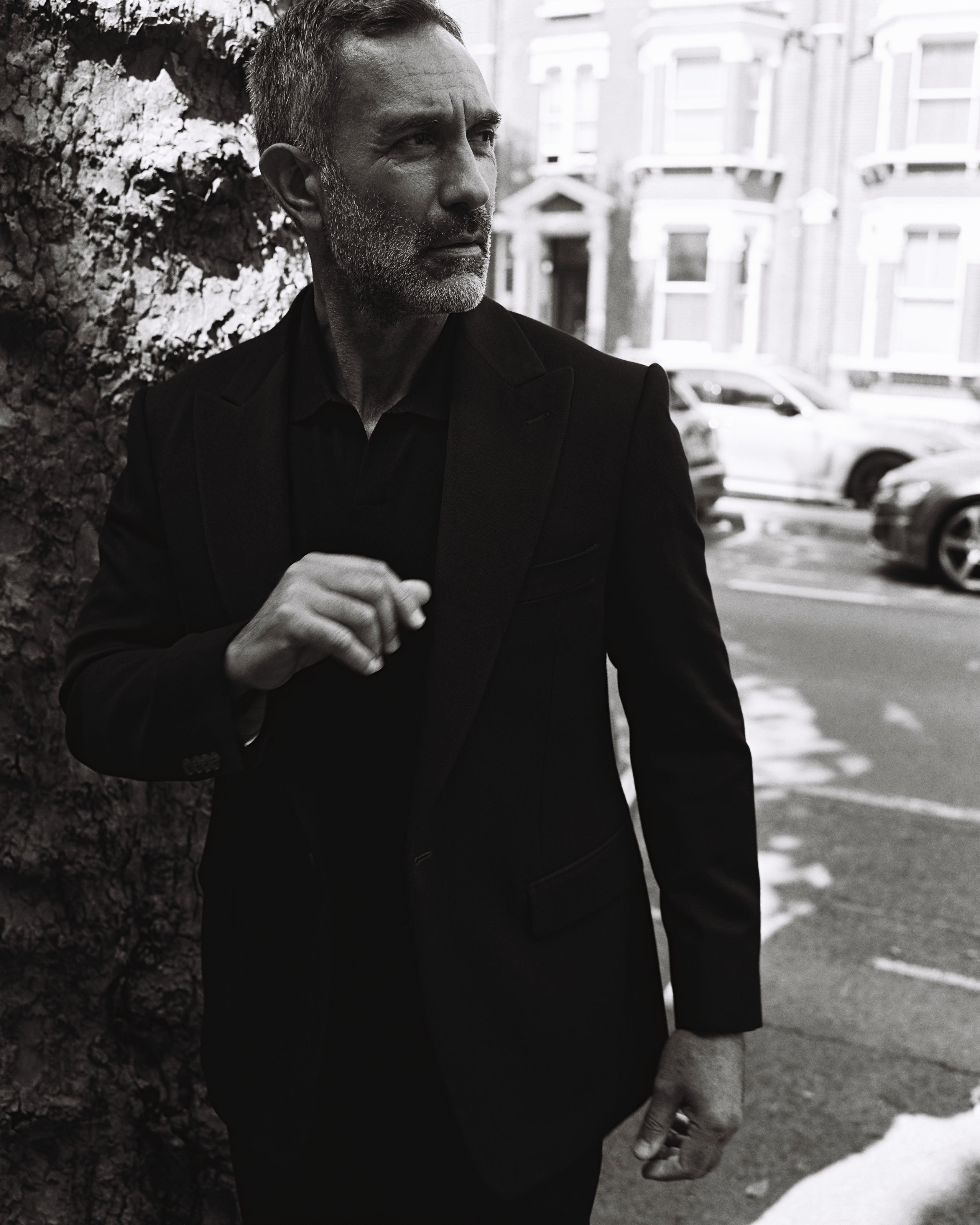 Model wears Casely-Hayford suit with knit.