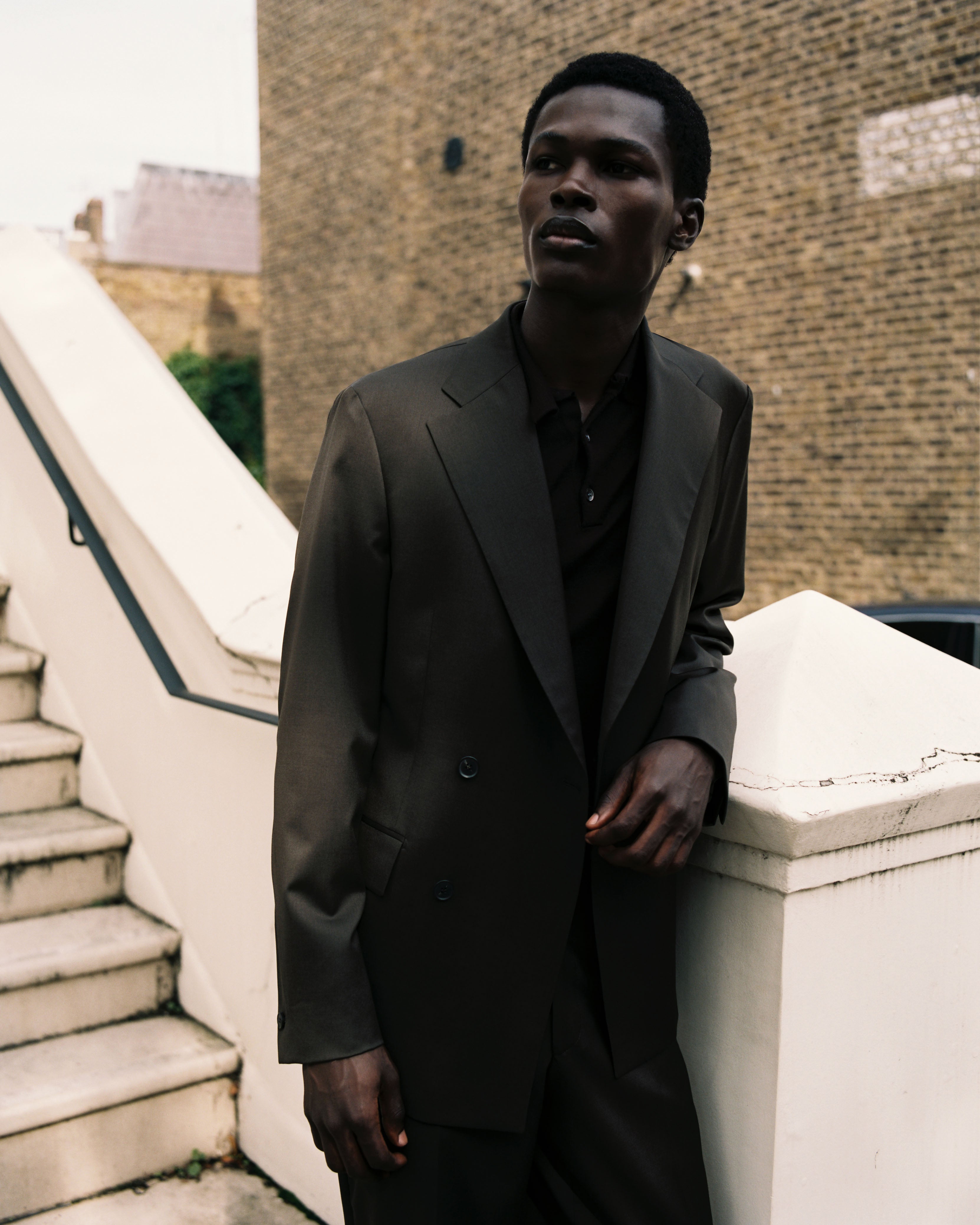 Model wears Casely-Hayford OFILI suit with knit. 