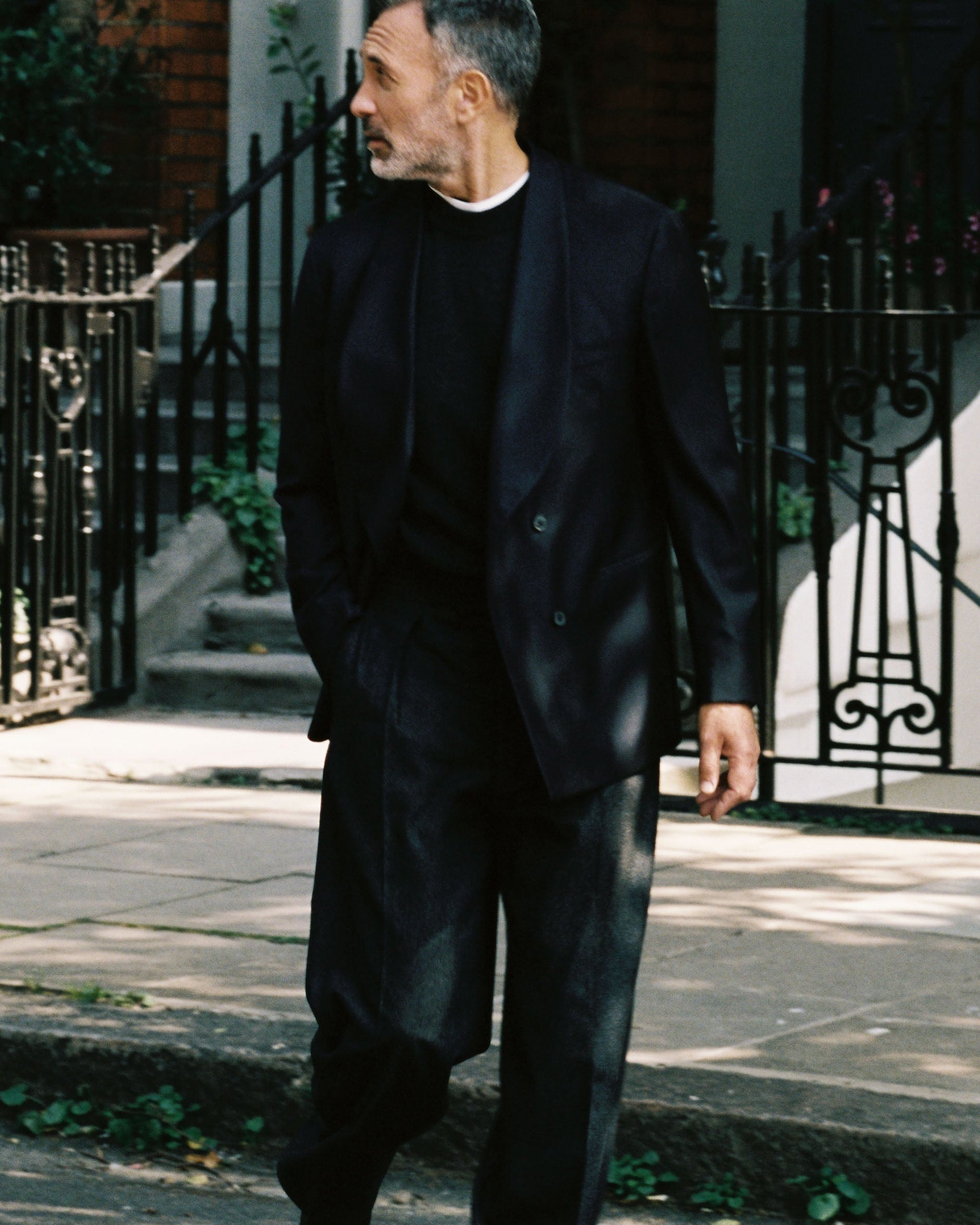 Model wears Casely-Hayford relaxed fit Hendrix jacket and Fidel Trousers. 