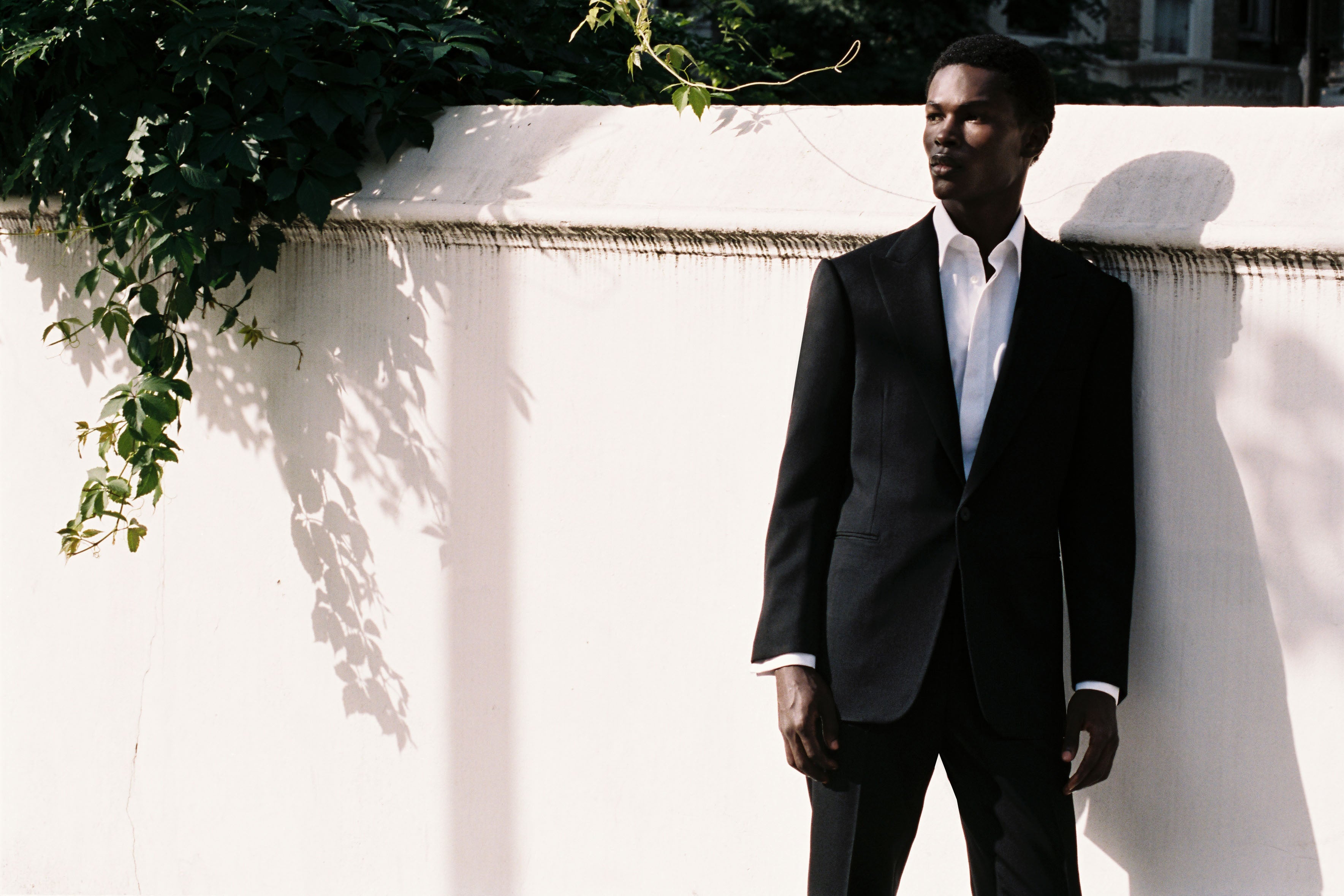 Model wears Casely-Hayford suit with Duval shirt. 