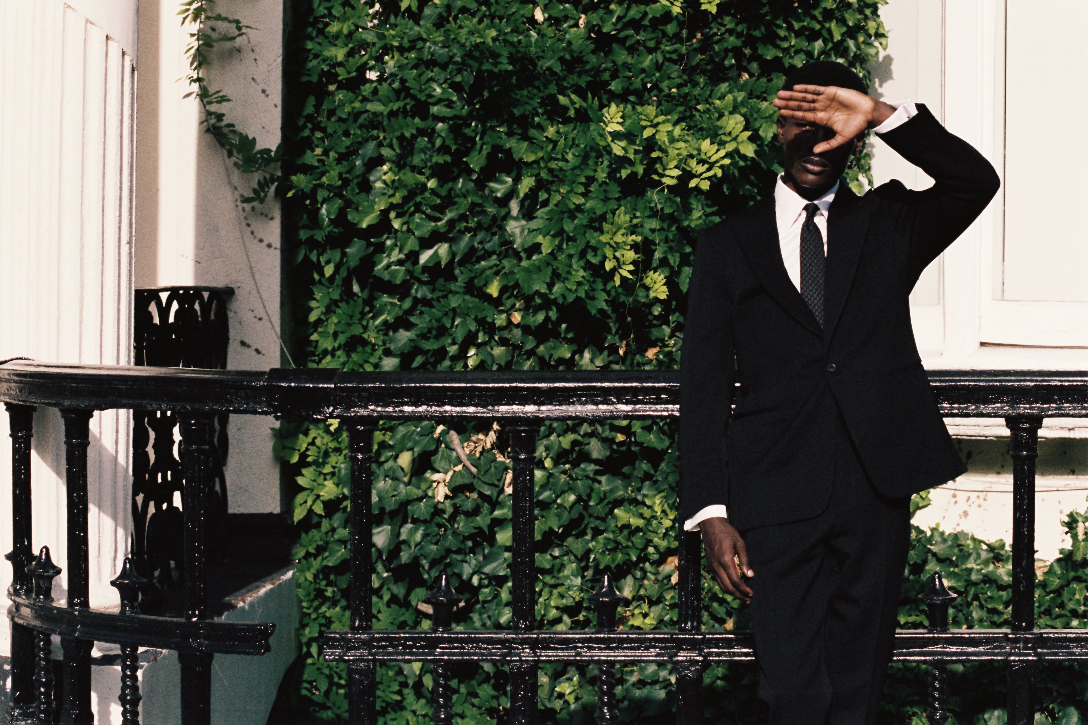 Model wears Casely-Hayford suit with Italian tie. 