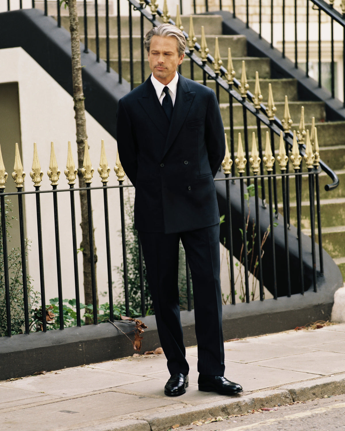 Model wears Casely-Hayford Yinka suit in Navy. 
