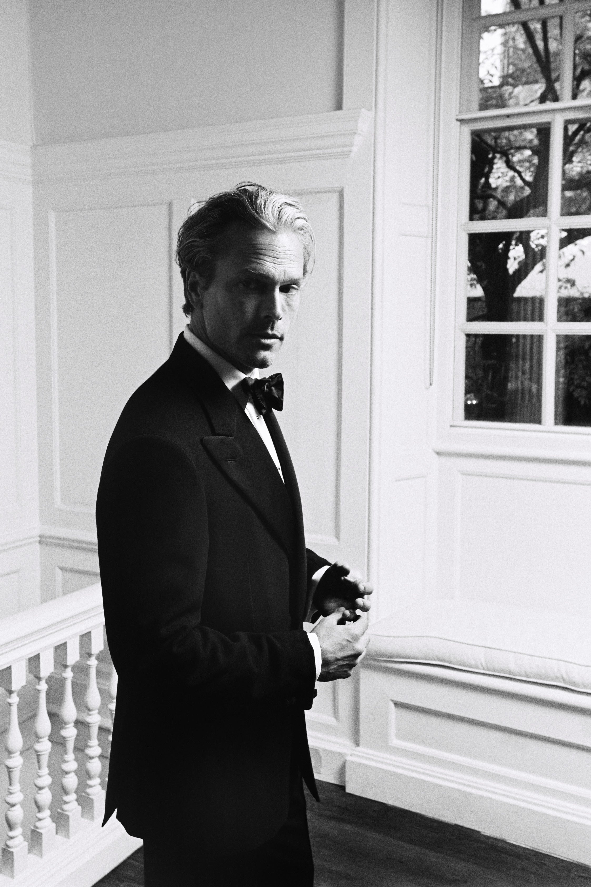 Model wears Casely-Hayford dinner suit in black.