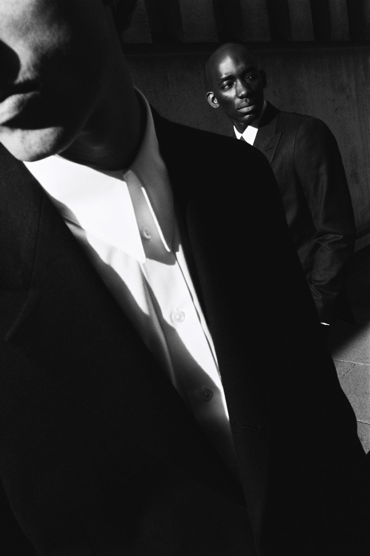 Model wears Casely-Hayford suit and pointed collar shirt. 