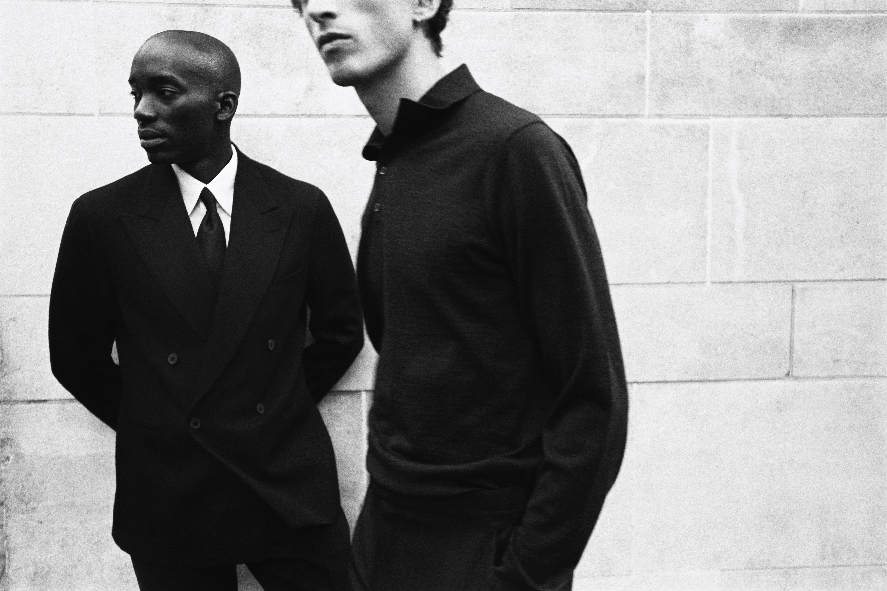 Black and white photo of models wearing Casely-Hayford suit and casual look.