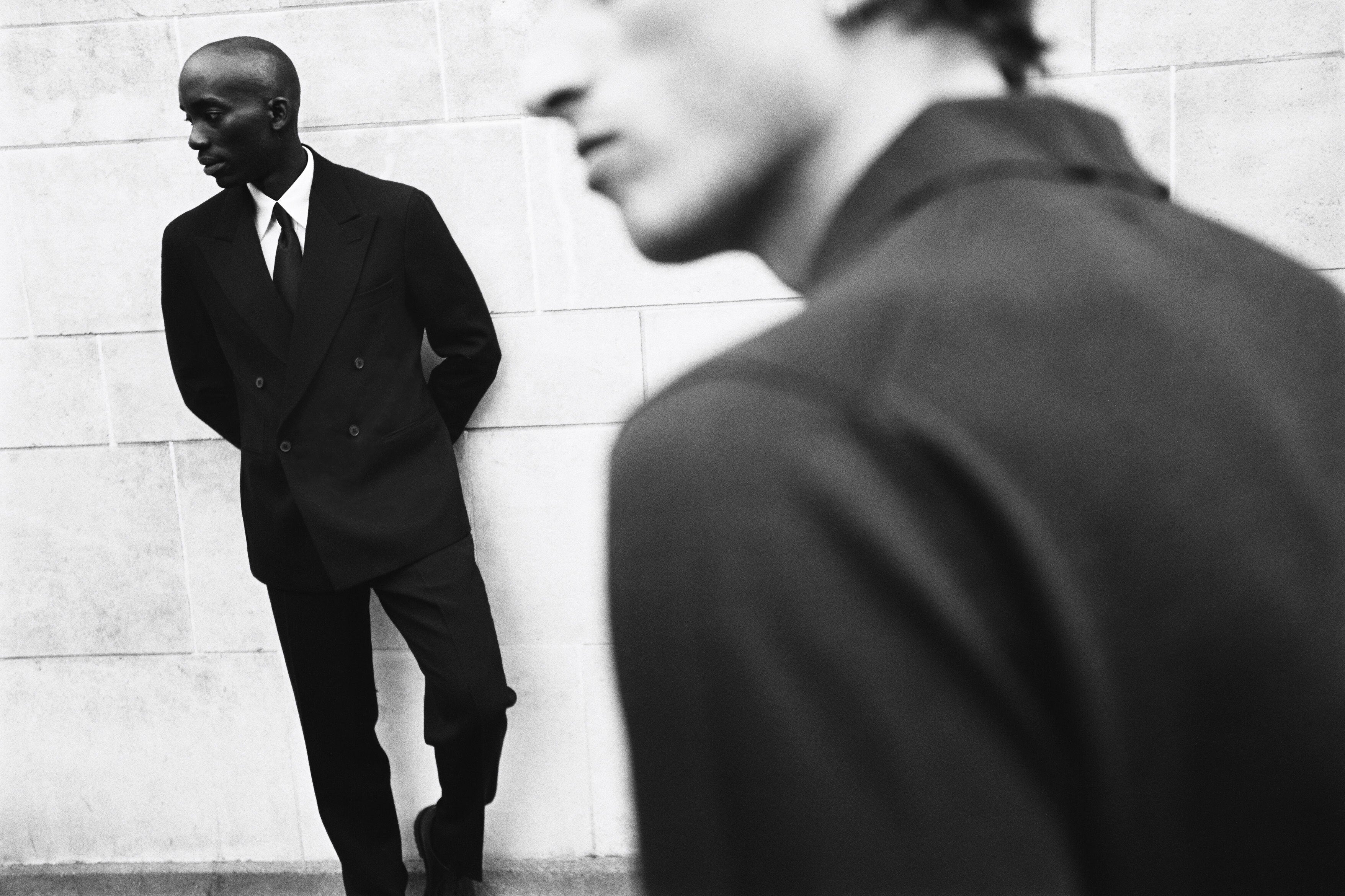 Black and white photo of model wearing Casely-Hayford suit. 