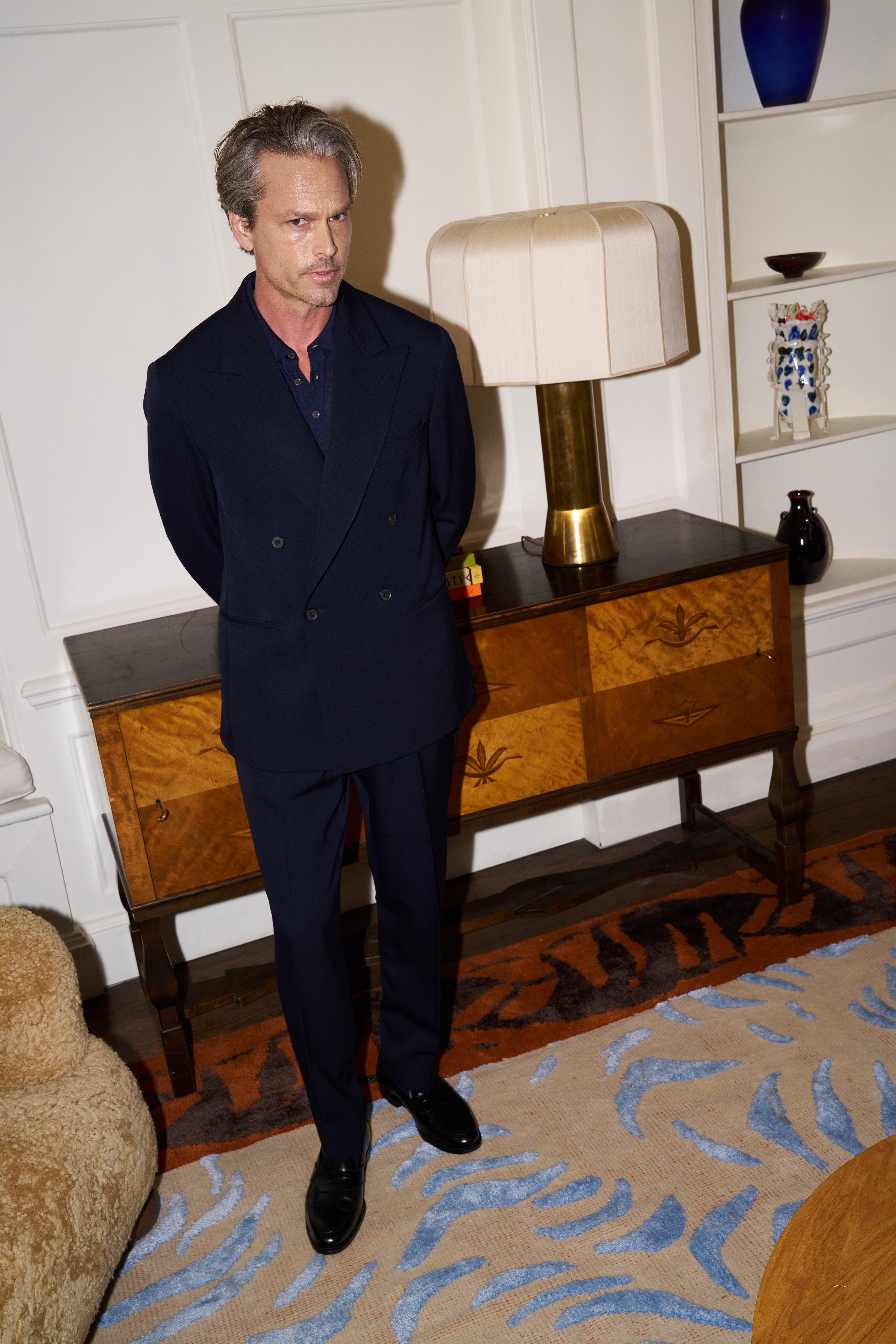 Model wear Casely-Hayord Yinka Suit in Navy Barathea. 