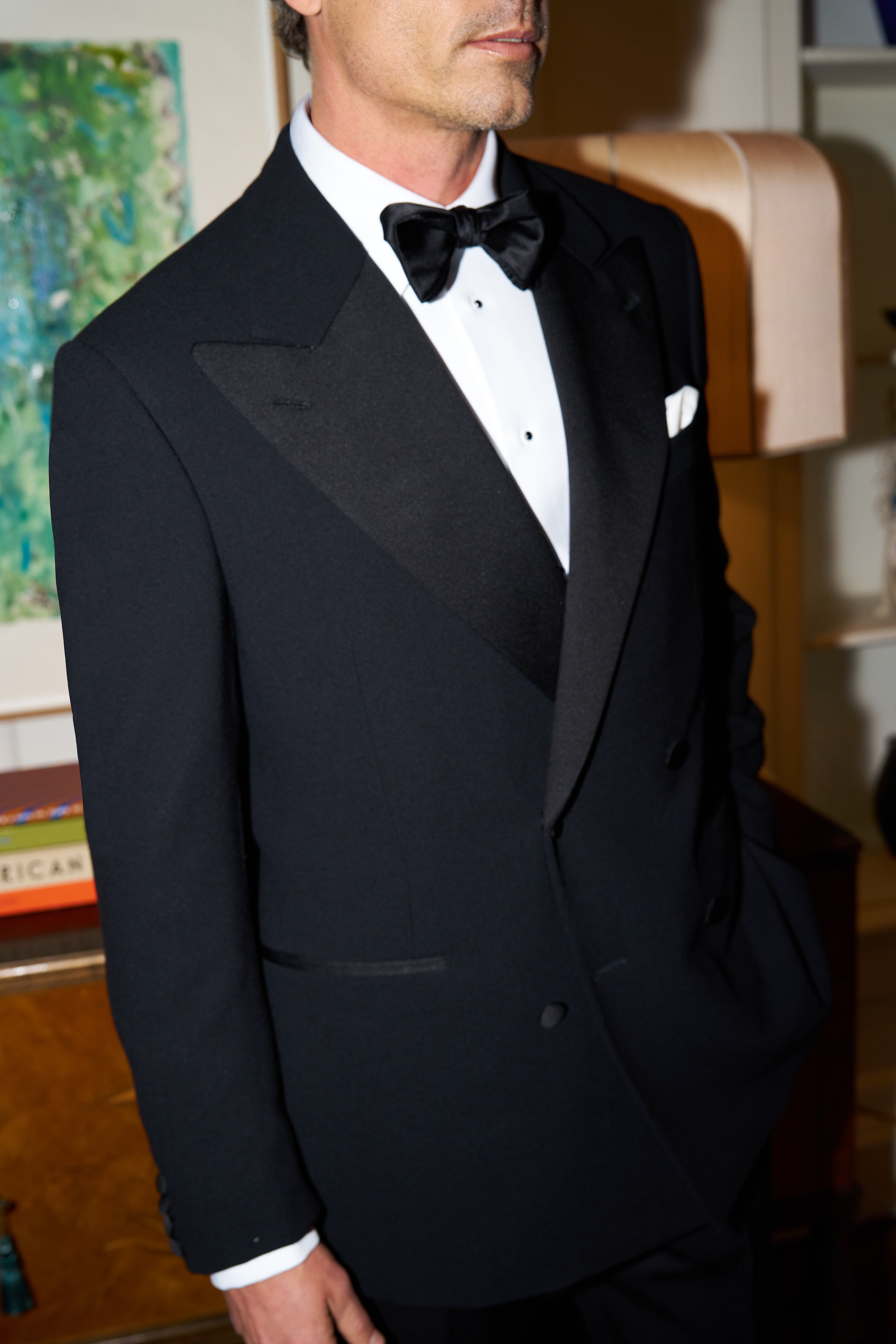 Model wears a Casely-Hayford handmade black tuxedo.