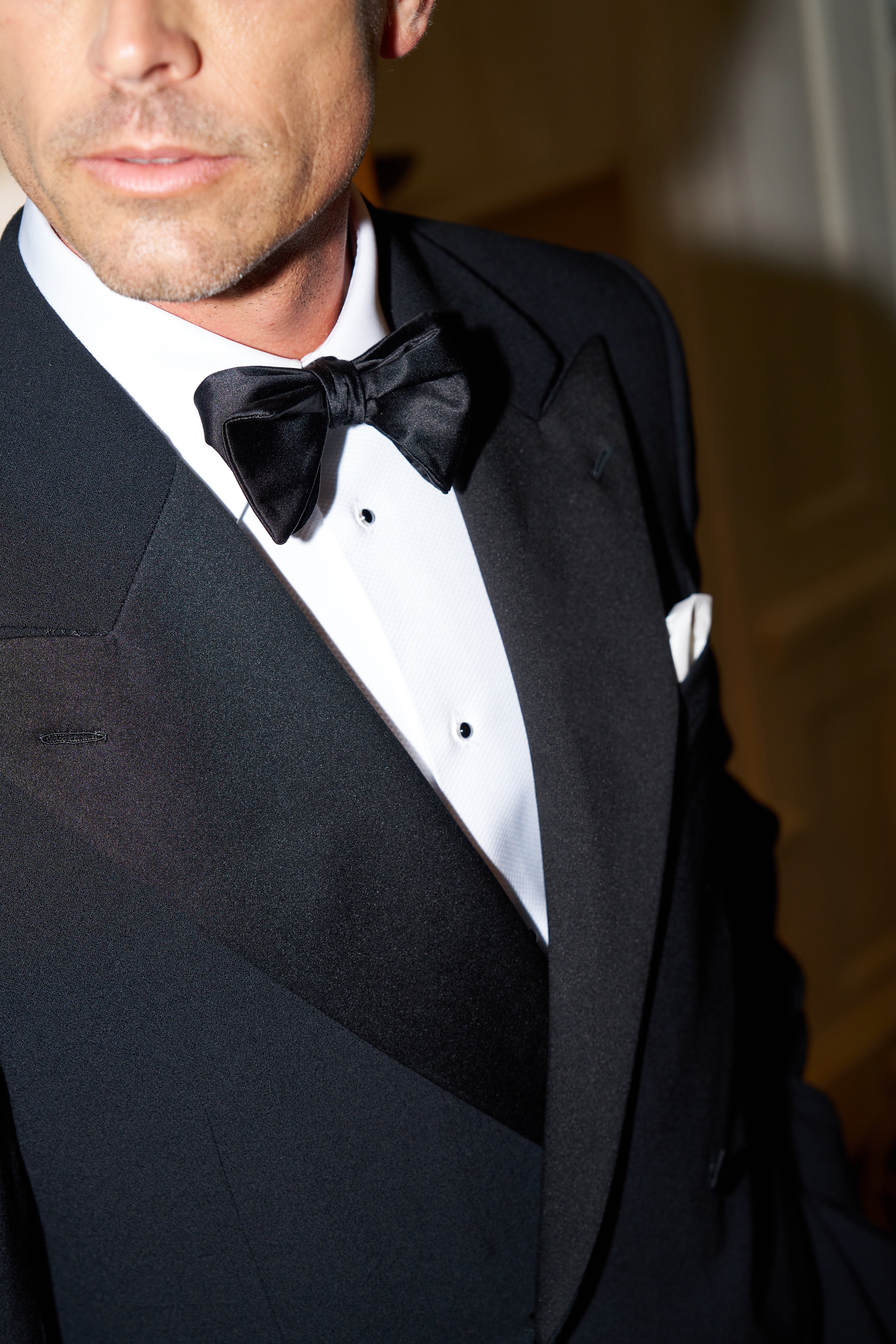 Close up of model wearing Casely-Hayford Markus Shirt and Tuxedo. 