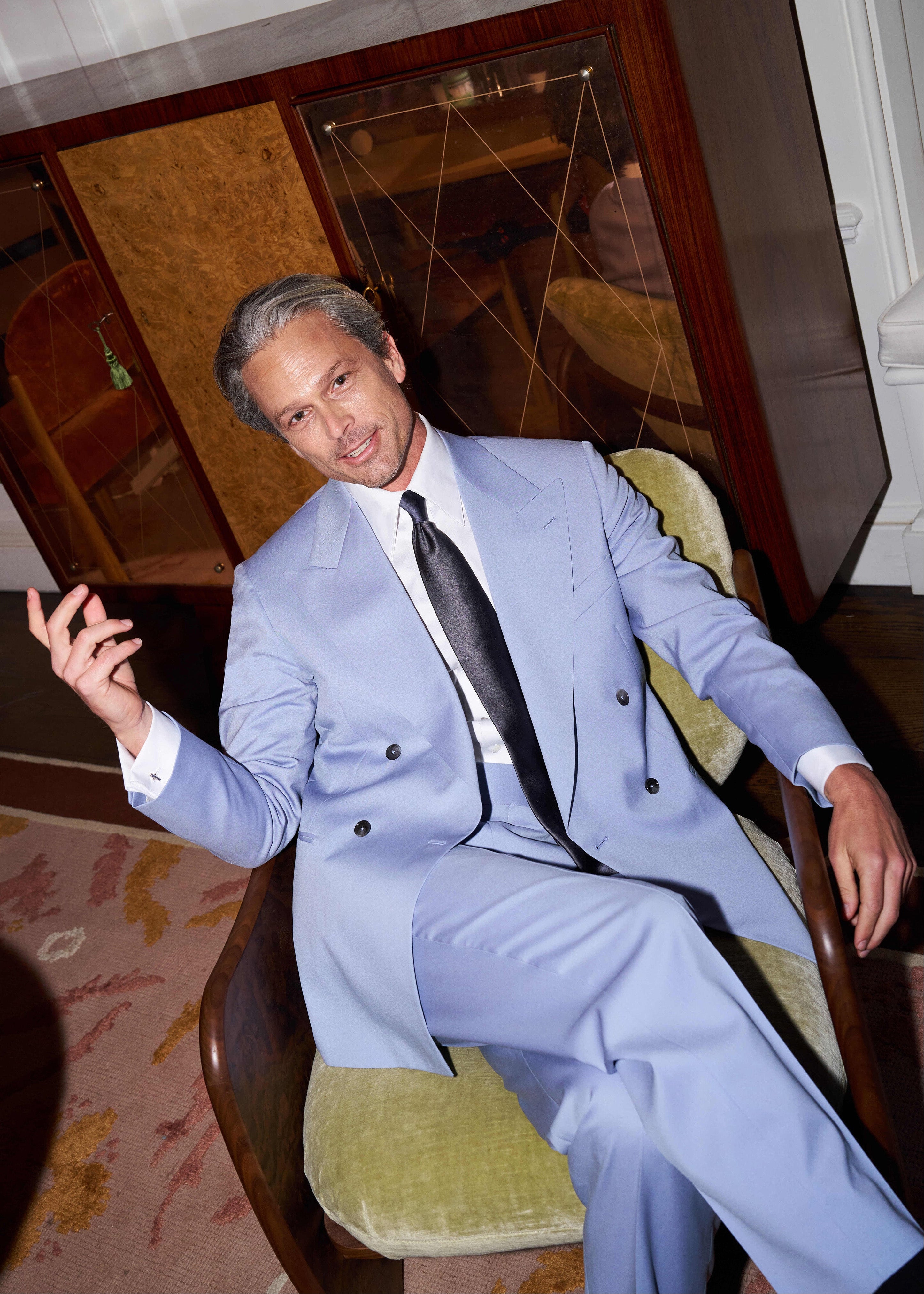 Model wears Casely-Hayford Yinka suit in dove lilac. paired with Duval shirt and Italian tie. 