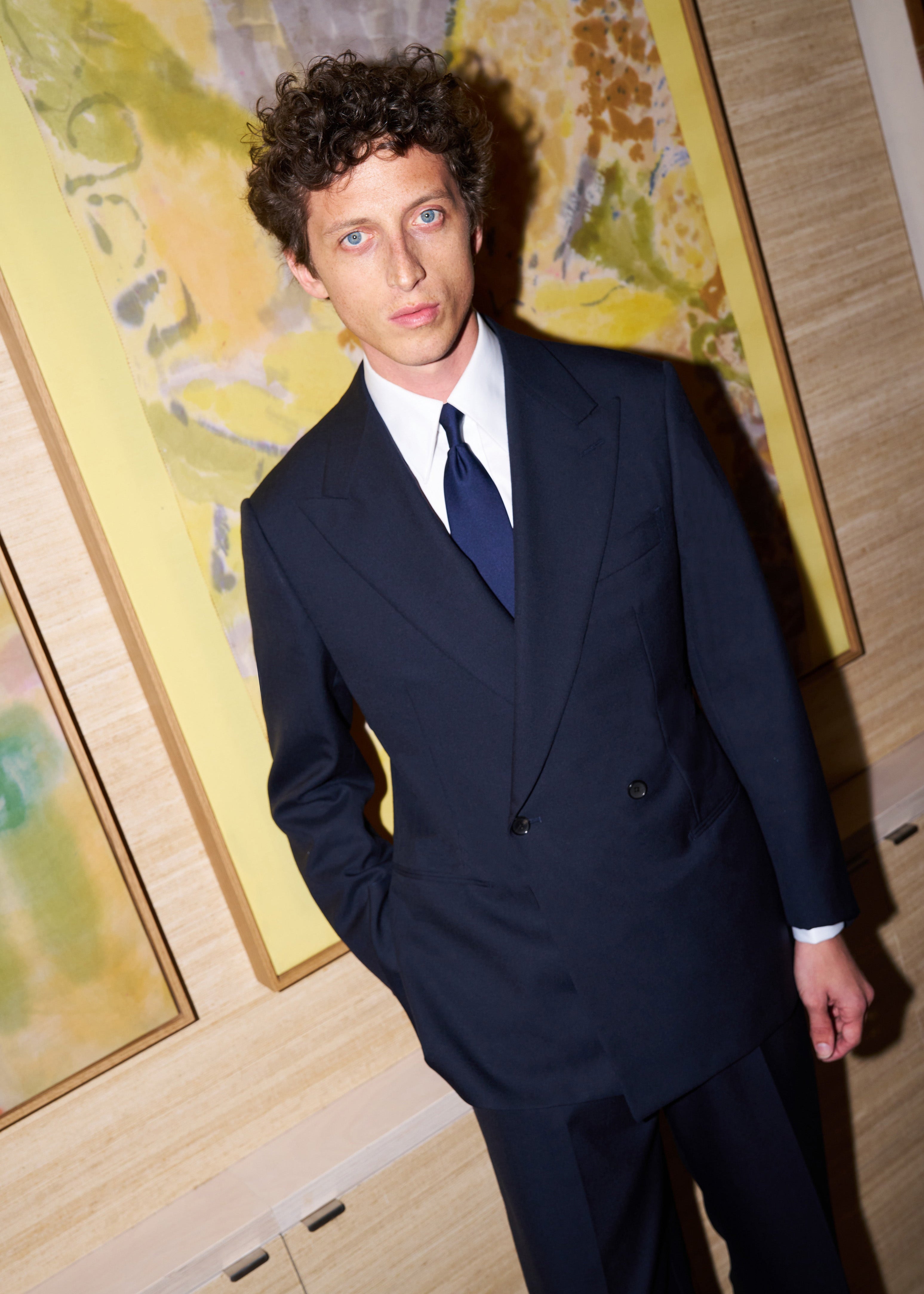 Model wears Casely-Hayford made-to-measure suit in Navy wool. 
