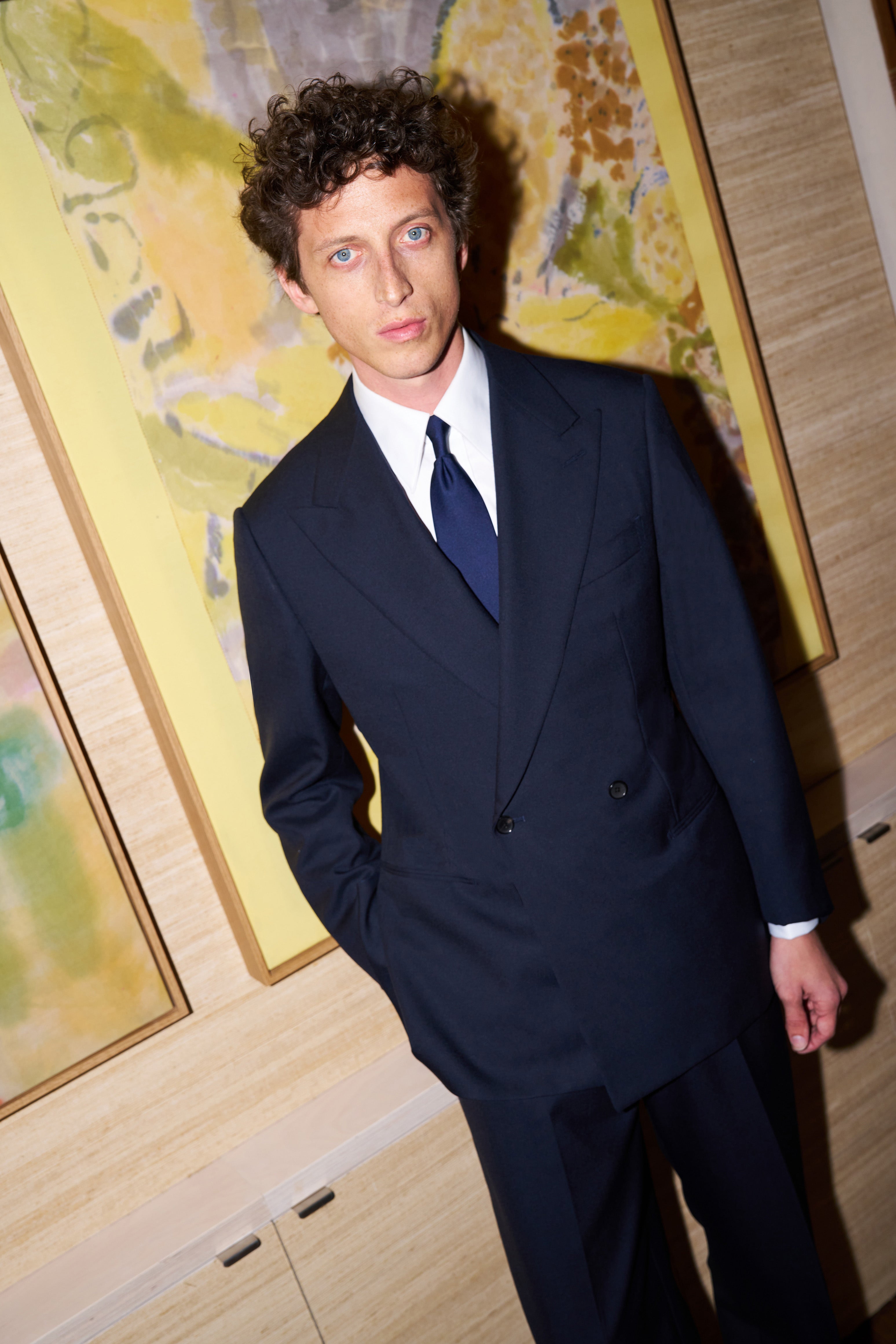 Model wear Casely-Hayford made-to-measure suit in Navy wool. 