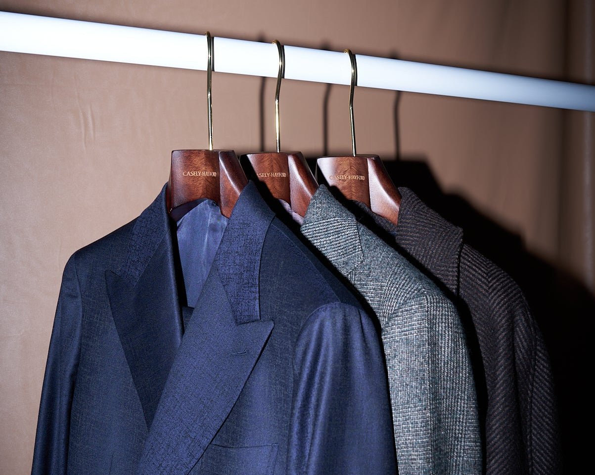 Three Casely-Hayford Suits Hanging on a rail. 