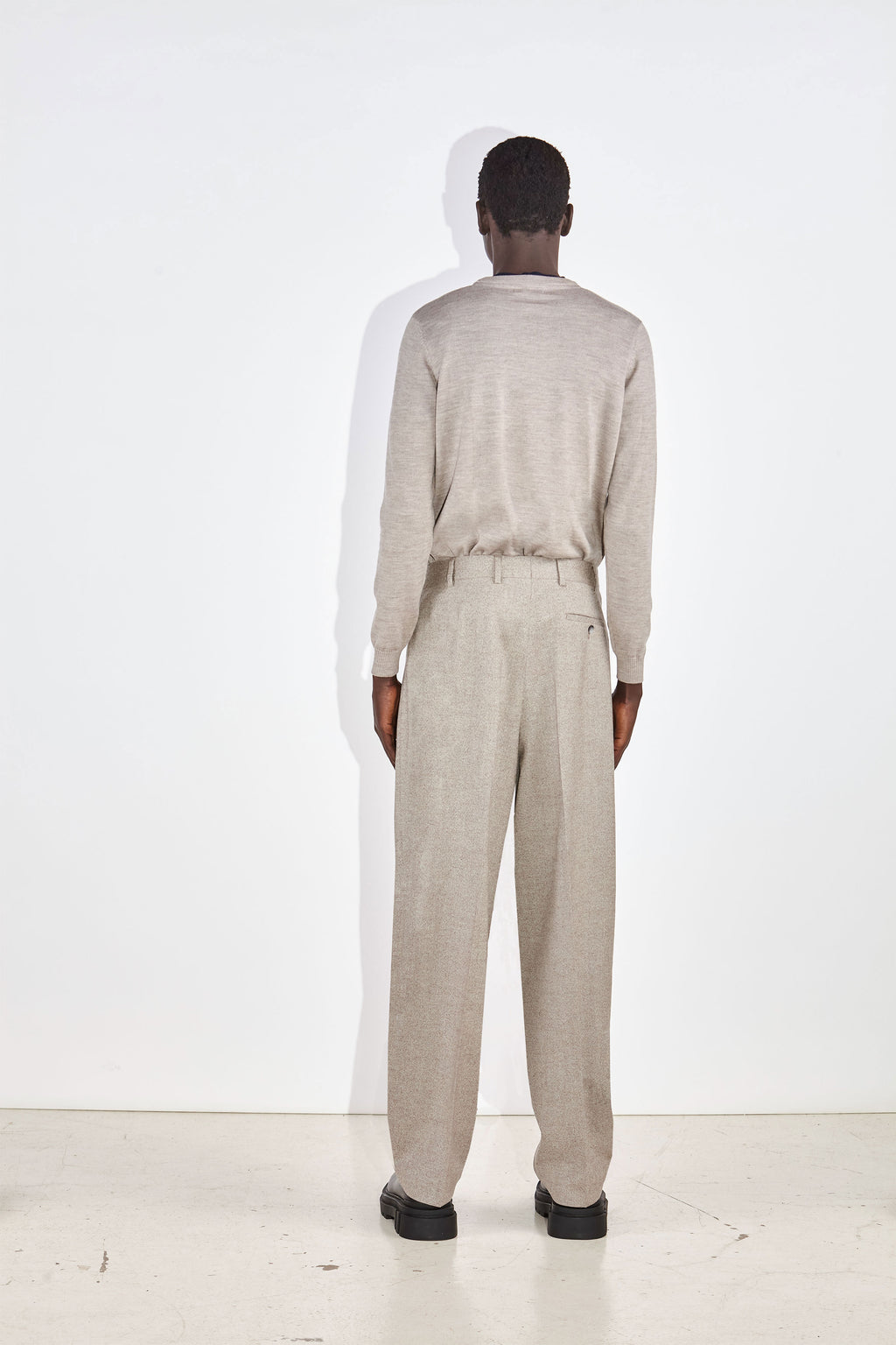 Model wears the Casely-Hayford Augustin crew neck jumper in Barley merino wool