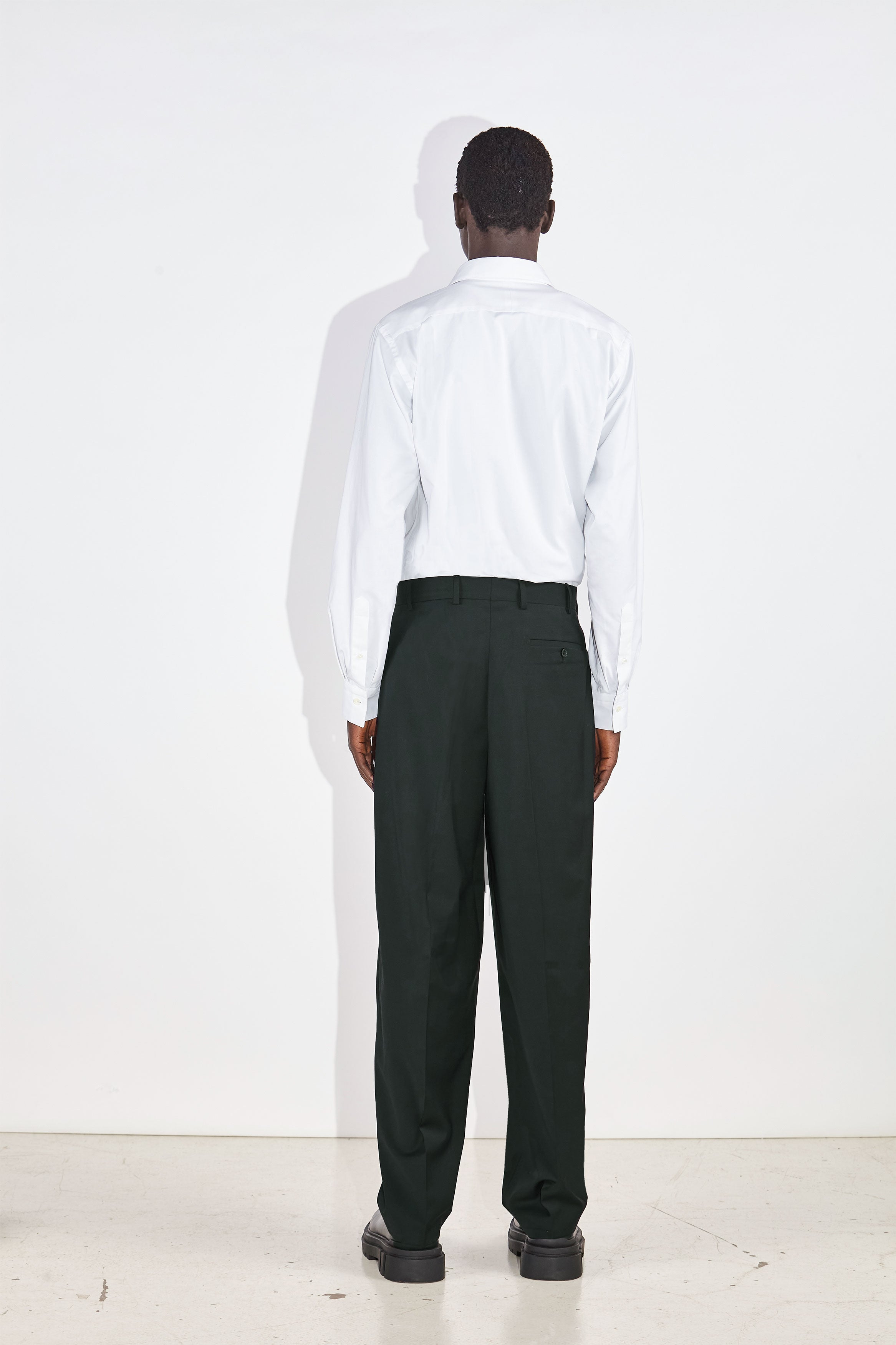 Model wears Casely-Hayford Duval White Long Point Collar Cotton Shirt. 