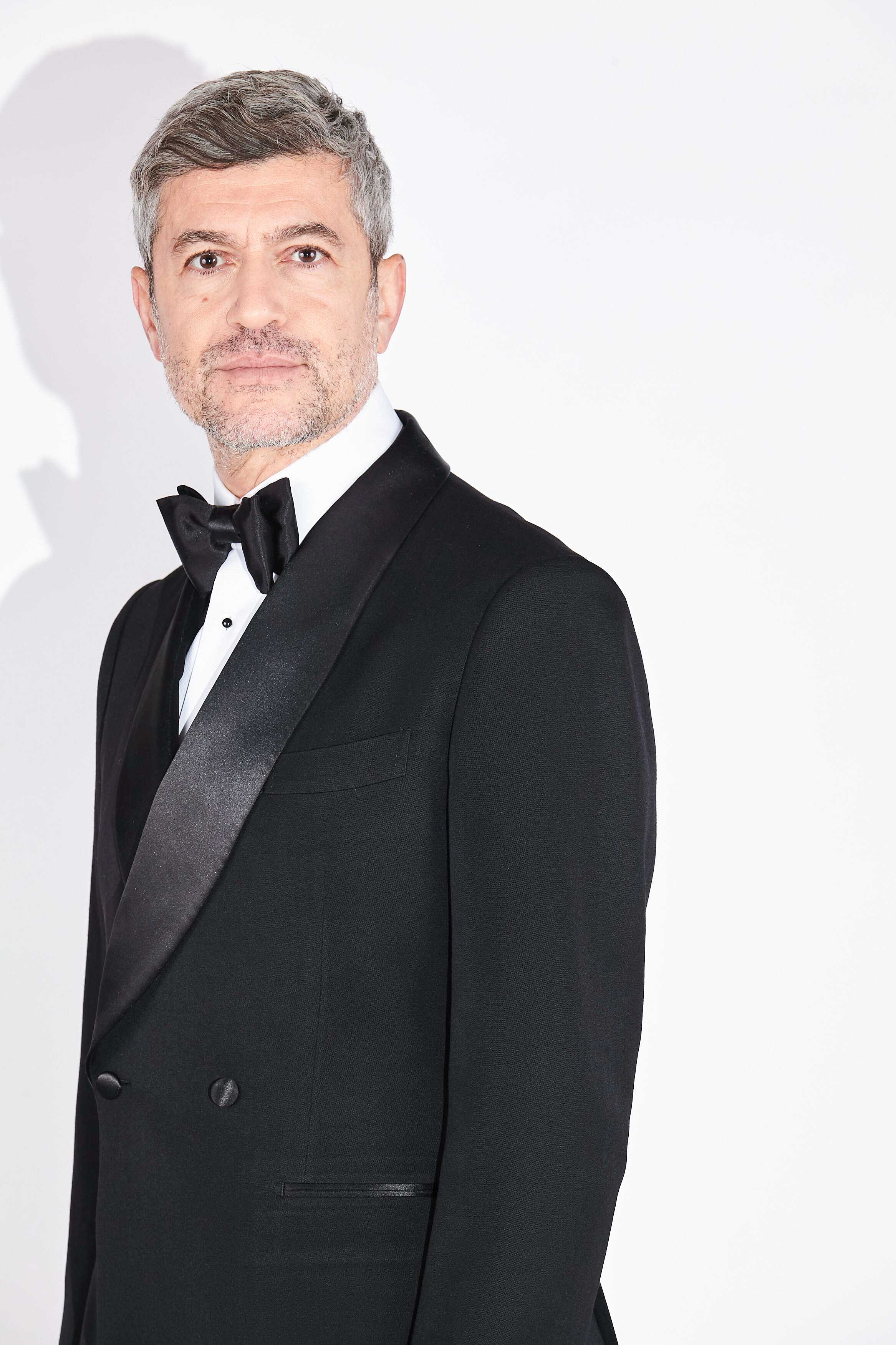 Model wears Casely-Hayford Pre-tied Handmade Silk Bow Tie.