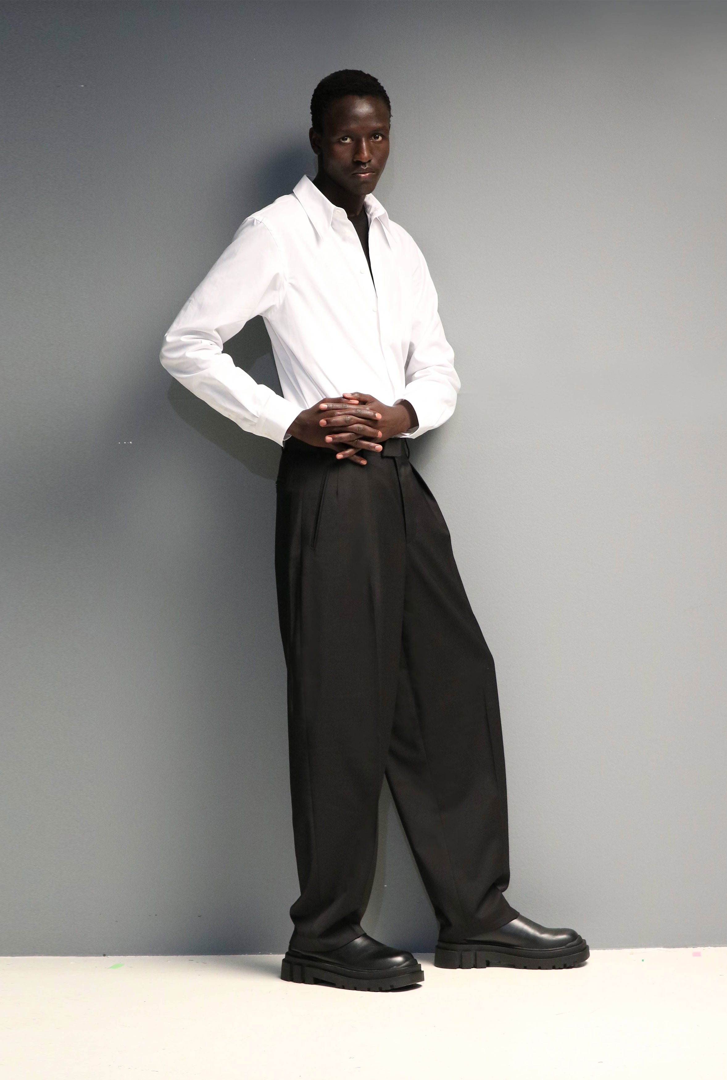 Model wears Casely-Hayford Duval White Long Point Collar Cotton Shirt. 