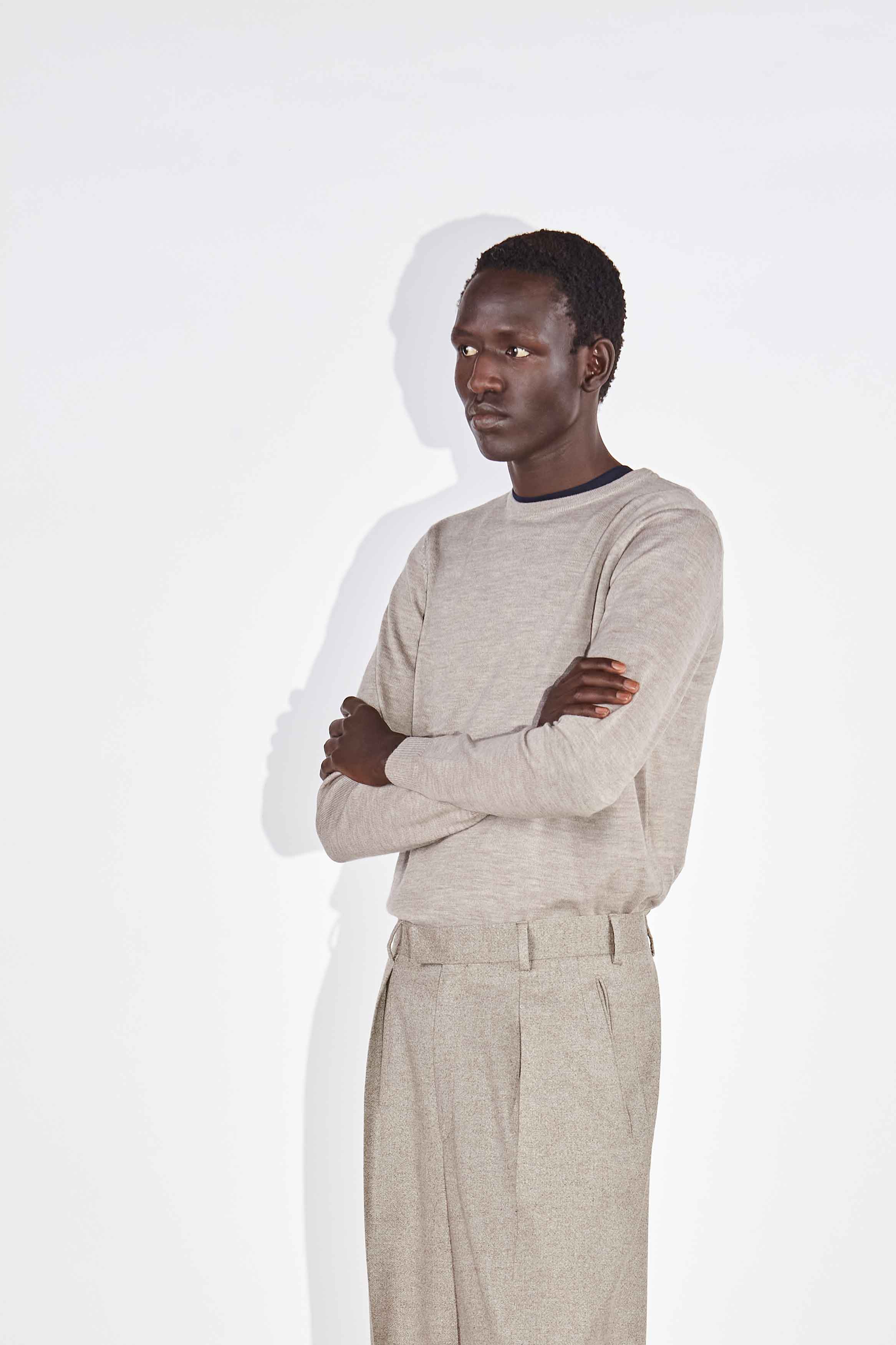 Model wears the Casely-Hayford Augustin crew neck jumper in Barley merino wool